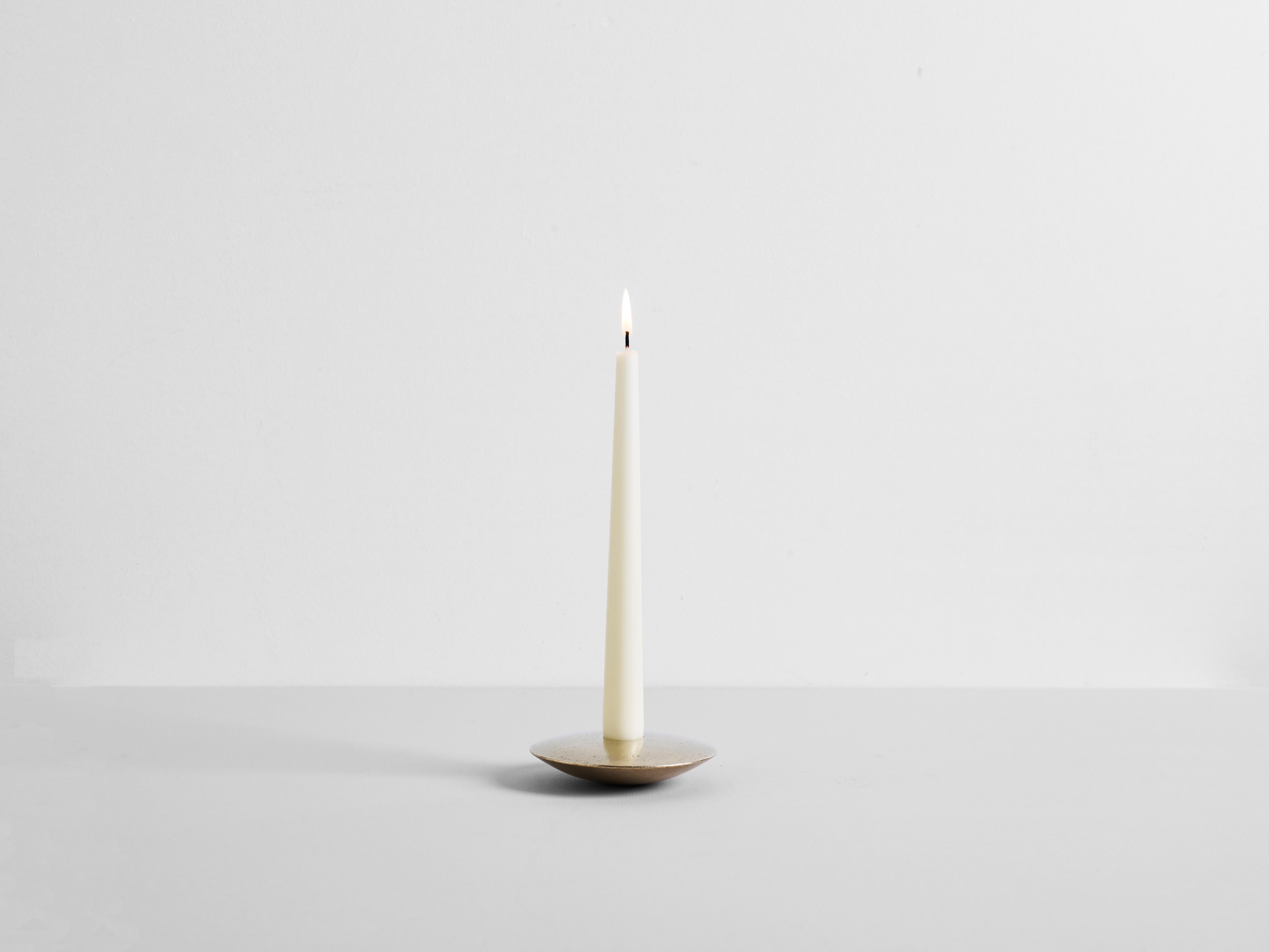 Set of 3 Almendres Candle Holders by Henry Wilson
Dimensions: Ø 11 x H 3 cm
Materials: Brass

The Almendres Candle Holder is a solid, hand-poured brass form with an almond-shaped profile.
It's manufactured in small batches; slight variations will