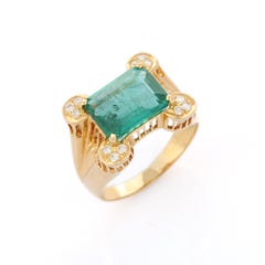 Enticing 3.94 Ct Green Emerald and Diamond Set in 18K Yellow Gold Cocktail Ring