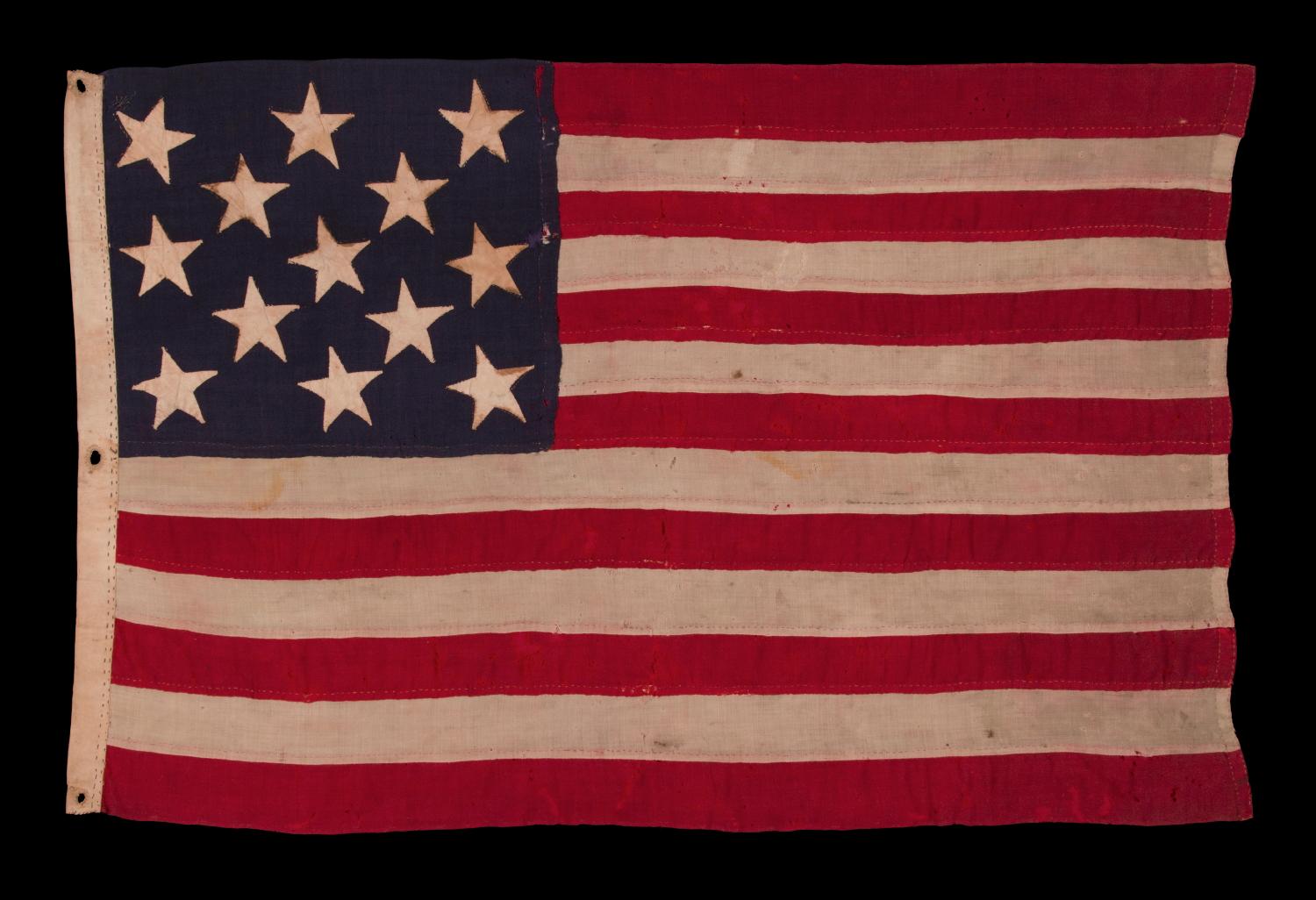 ENTIRELY HAND-SEWN, 13 STAR, U.S. NAVY SMALL BOAT ENSIGN, CA 1882-1890 

13 star American national flag of the type used by the U.S. Navy on small boats in the latter 19th and early 20th centuries. The Navy produced signals in several locations,