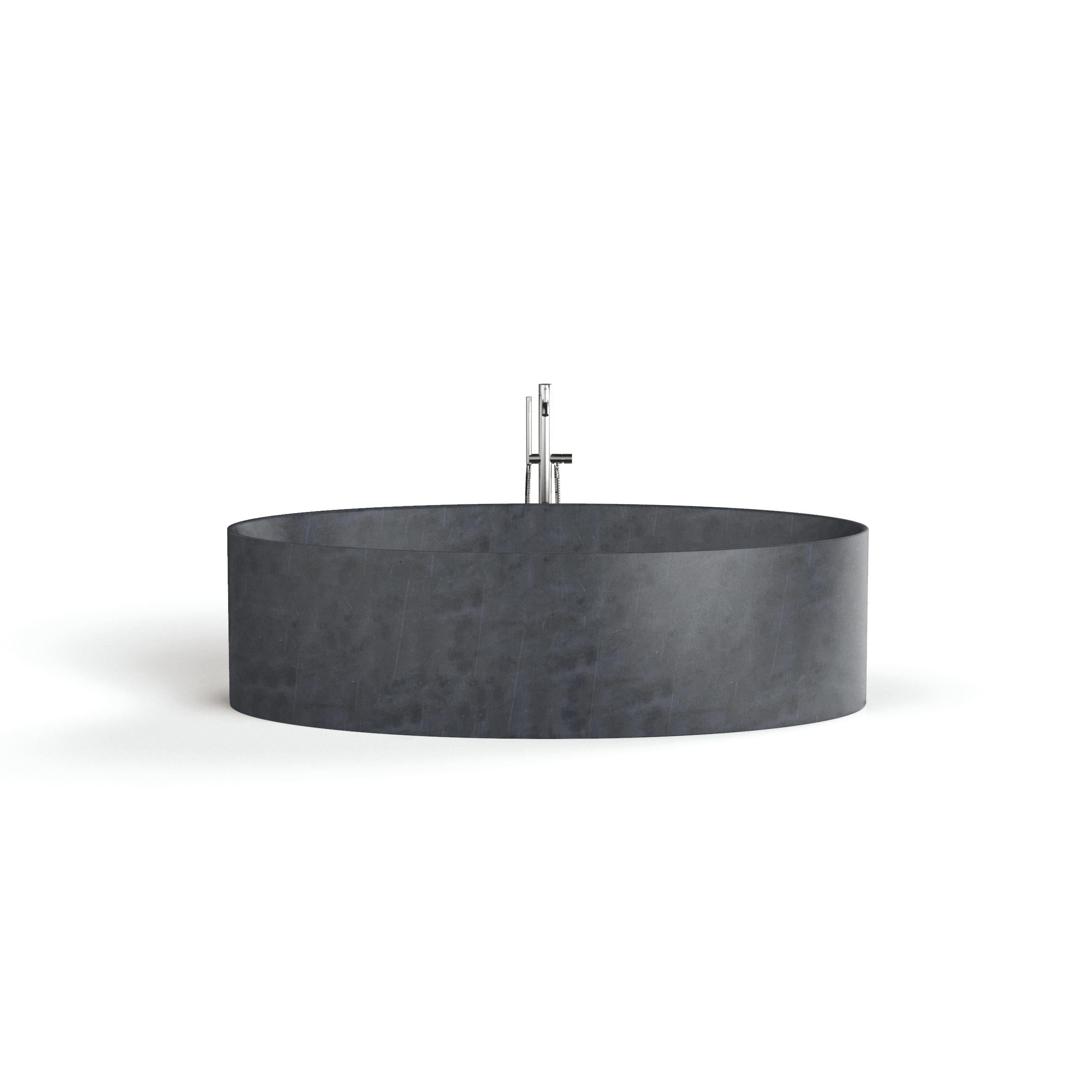 Entity Ovale bath by Marmi Serafini
Materials: Pietra Lavica marble.
Dimensions: D 105 x W 180 x H 50 cm
Available in other marbles.
Tap not included.

Entirely made from one piece of stone, with the matching waste-drain cover this bath has generous