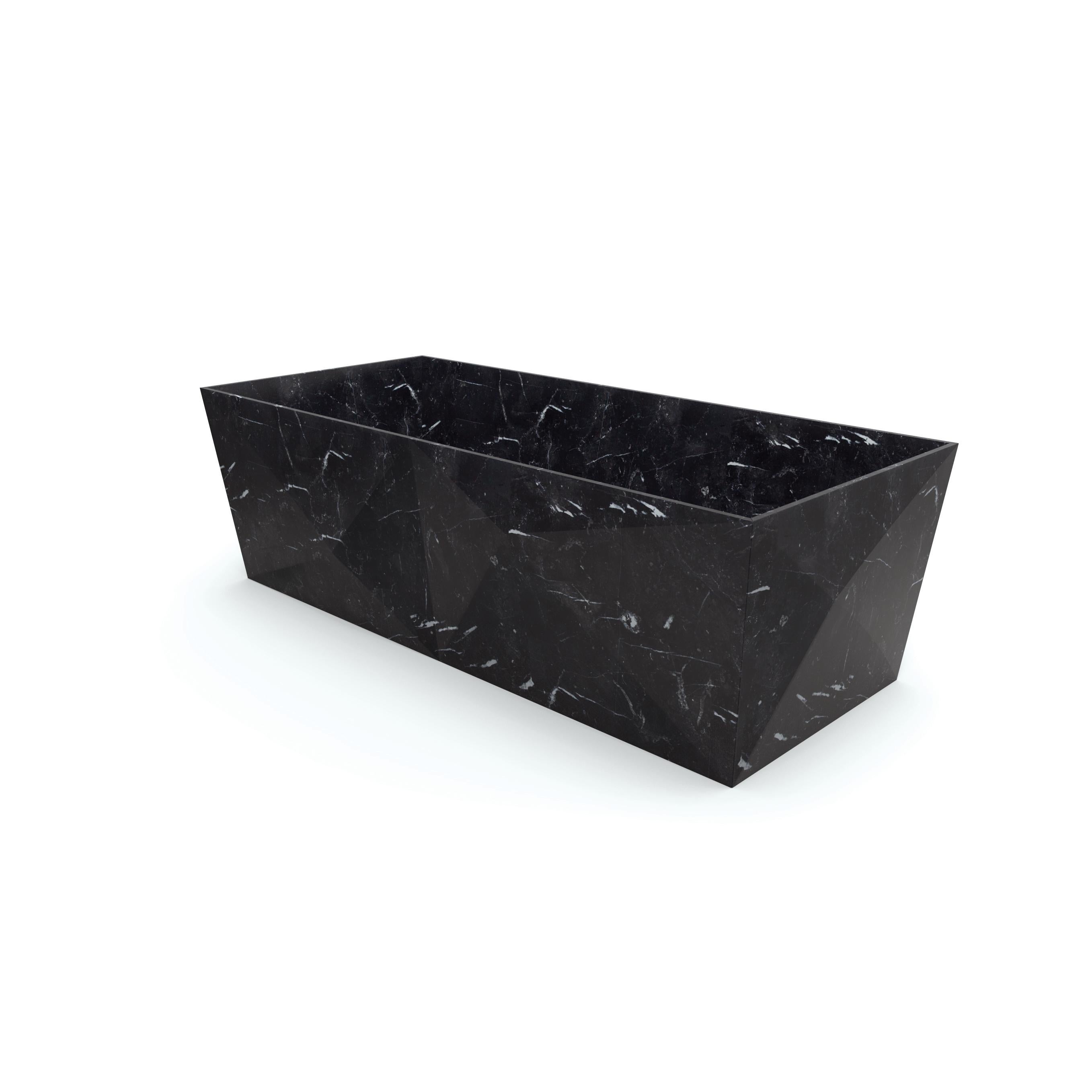 Entity Punta bath by Marmi Serafini
Materials: Nero Marquinia marble.
Dimensions: D 80 x W 180 x H 50 cm
Available in other marbles and assembled or on-block versions.
Tap not included.

Bold and striking lines that draw immediate attention.