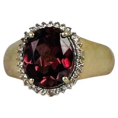 Anillo Entourage oro 14k amatista talla oval 3 quilates rodeada 32 zafiros blancos Corte oval