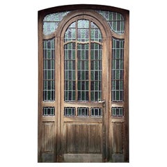 Entrance door and its stained glass surround