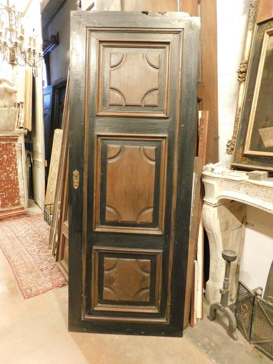 Antique entrance door, door in precious solid walnut wood, carved with diamonds and lacquered in black in the milling, A door without a frame, also adaptable as a sliding door or as a decorative panel, headboard or even possible to choose the