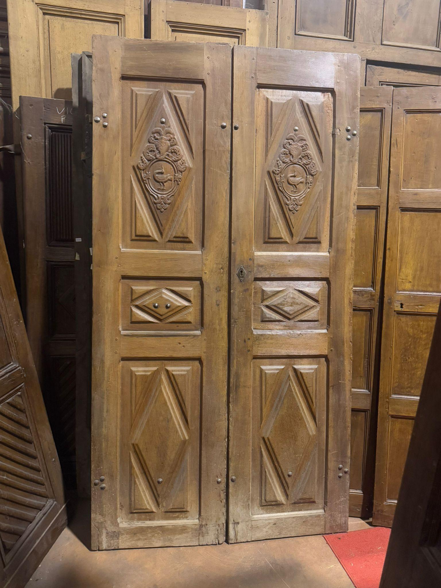 Italian Entrance door in walnut, with two doors and carved panels, Italy For Sale