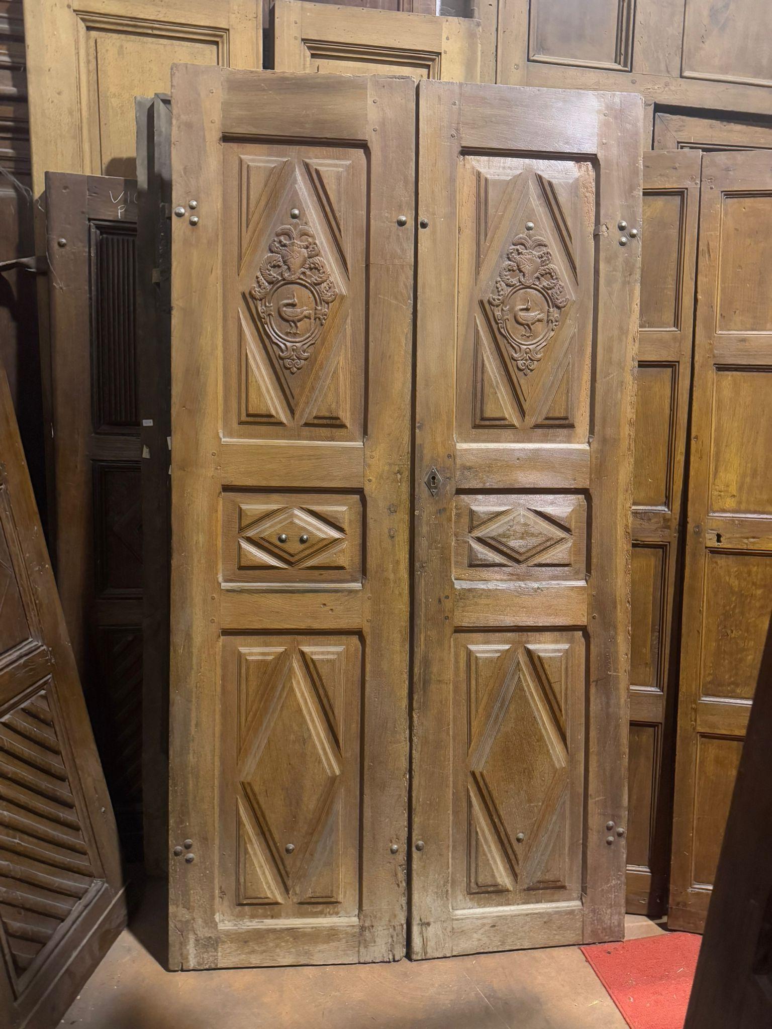 18th Century and Earlier Entrance door in walnut, with two doors and carved panels, Italy For Sale