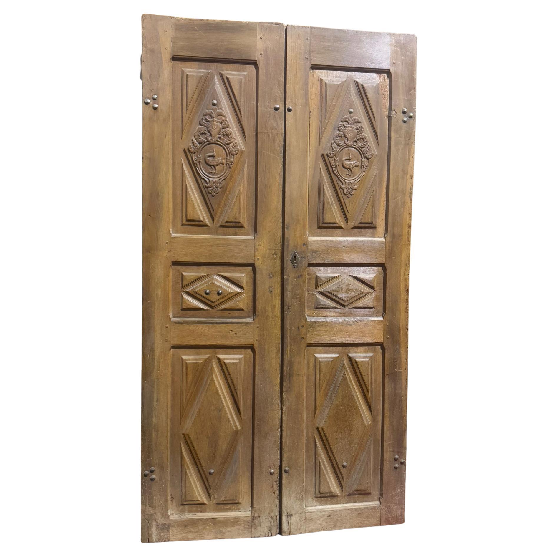 Entrance door in walnut, with two doors and carved panels, Italy For Sale