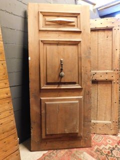 Entrance door, main door in carved walnut, with original ironwork, Italy