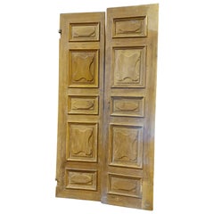 Entrance door  two wings carved in walnut, 
700 Italy