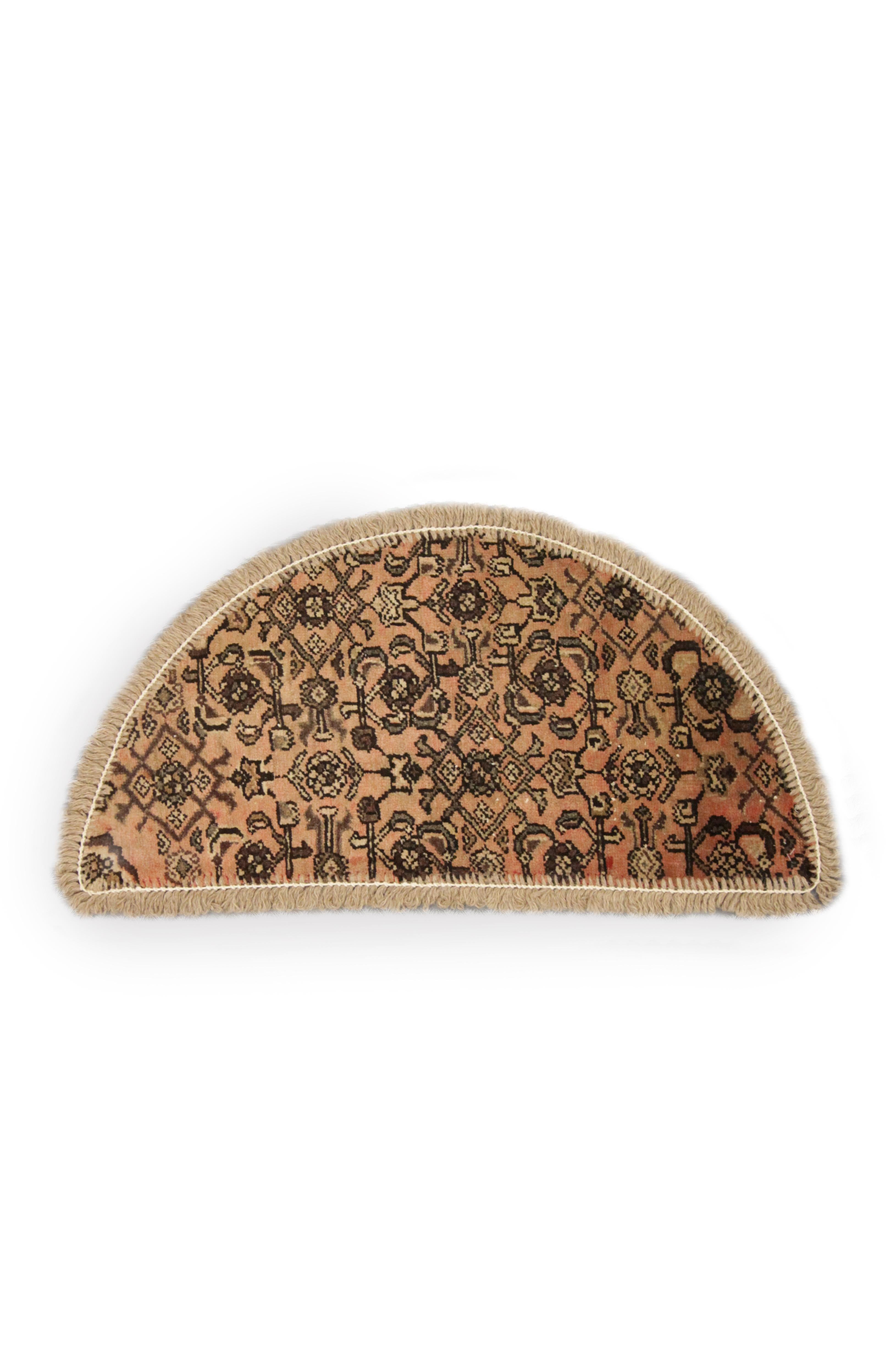 Featuring an all-over pattern handwoven carpet in beige and brown on a subtle orange background this little mat is perfect for any modern home or traditional interior. This semicircle entranceway doormat has been refurbished from a handmade vintage