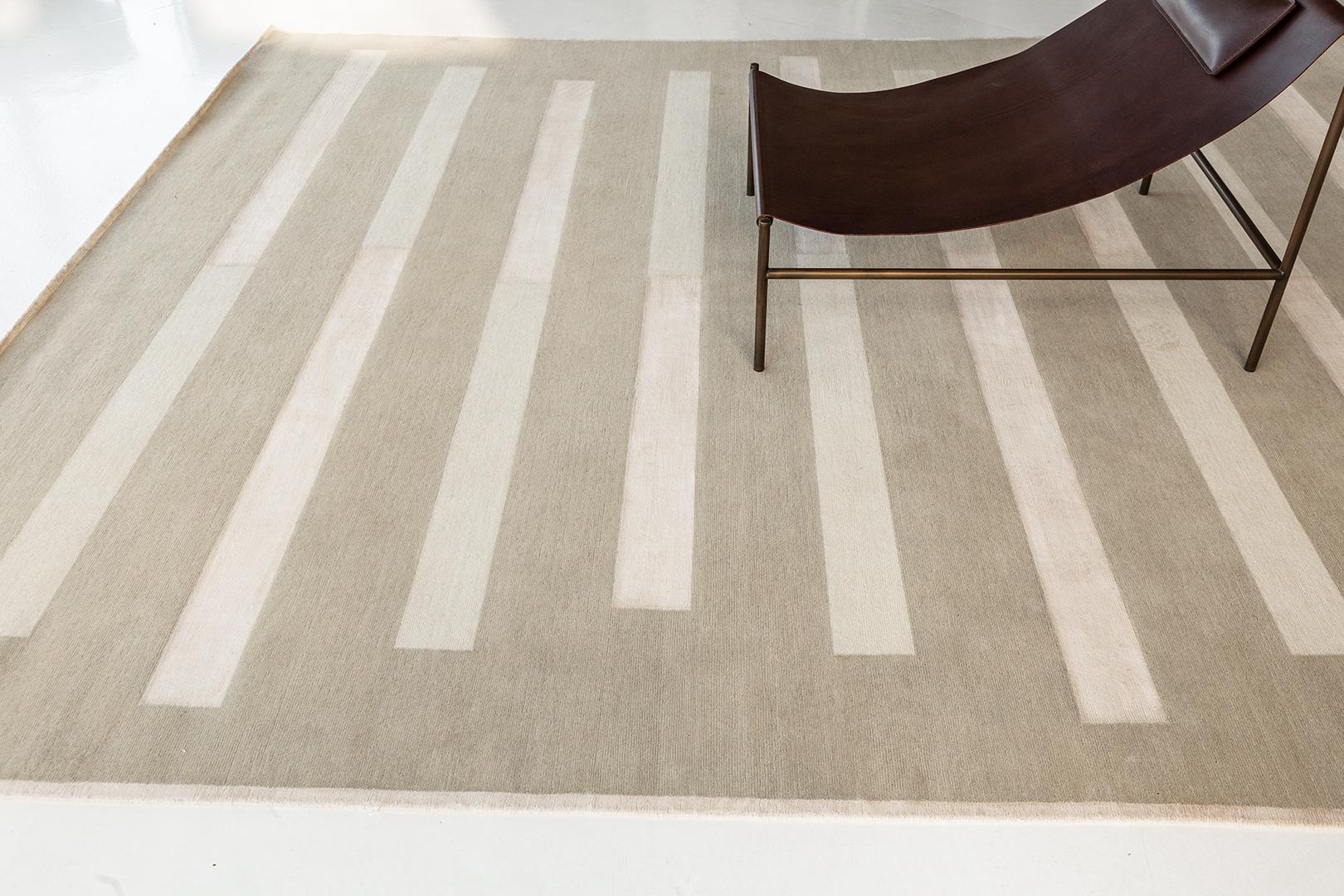 Entrée offers a classic grounding linear pattern, providing structure to any room. The simple transition from wool to silk in a singular line offers visual and tactile texture. Entrée is a study of linear composition and textural exploration.

Erica