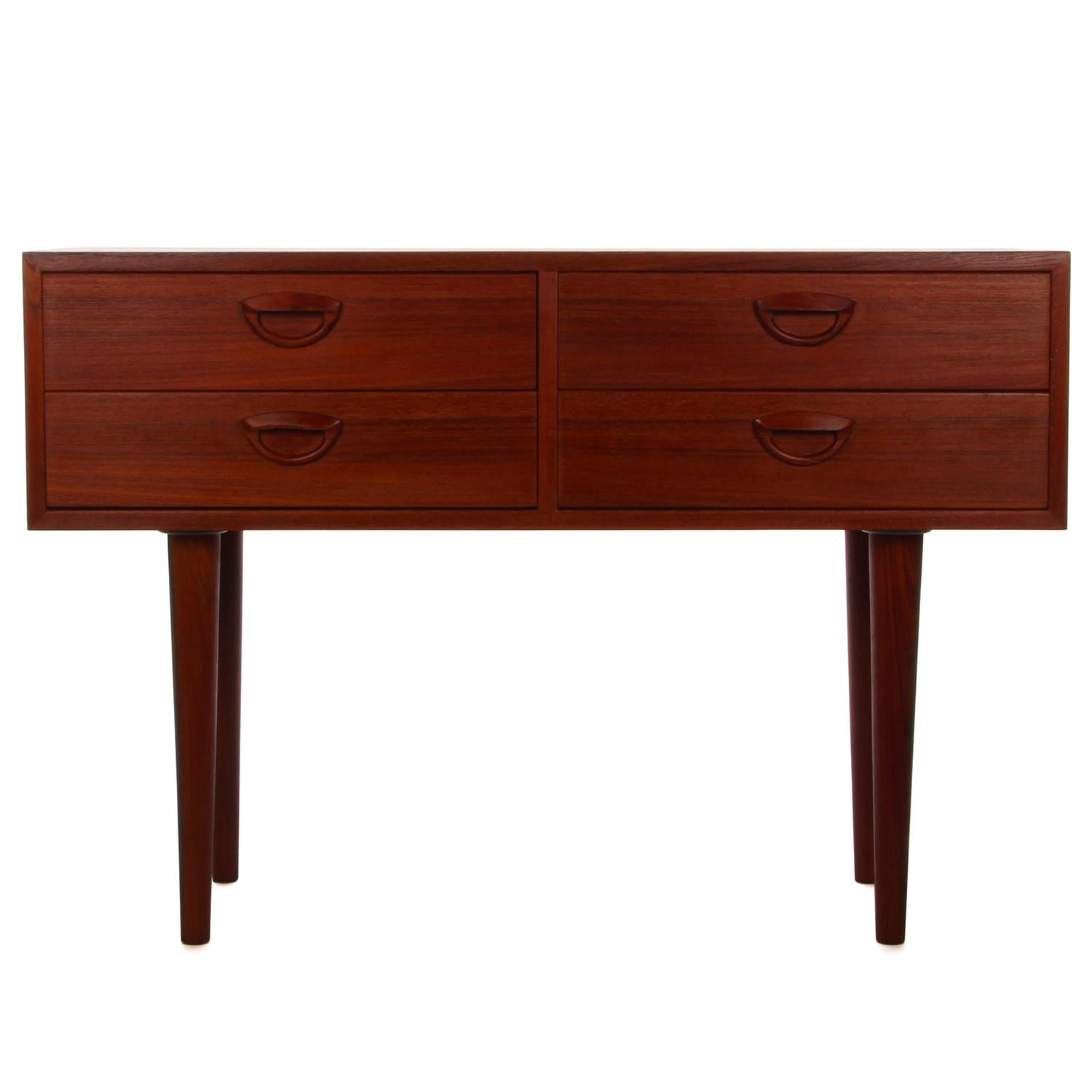 Teak entry table by Kai Kristiansen for FM Furniture, circa 1957 - super beautiful and very stylish entryway table with four drawers in very good vintage condition.

A classic midcentury piece crafted in teak with a rectangular shaped body carried