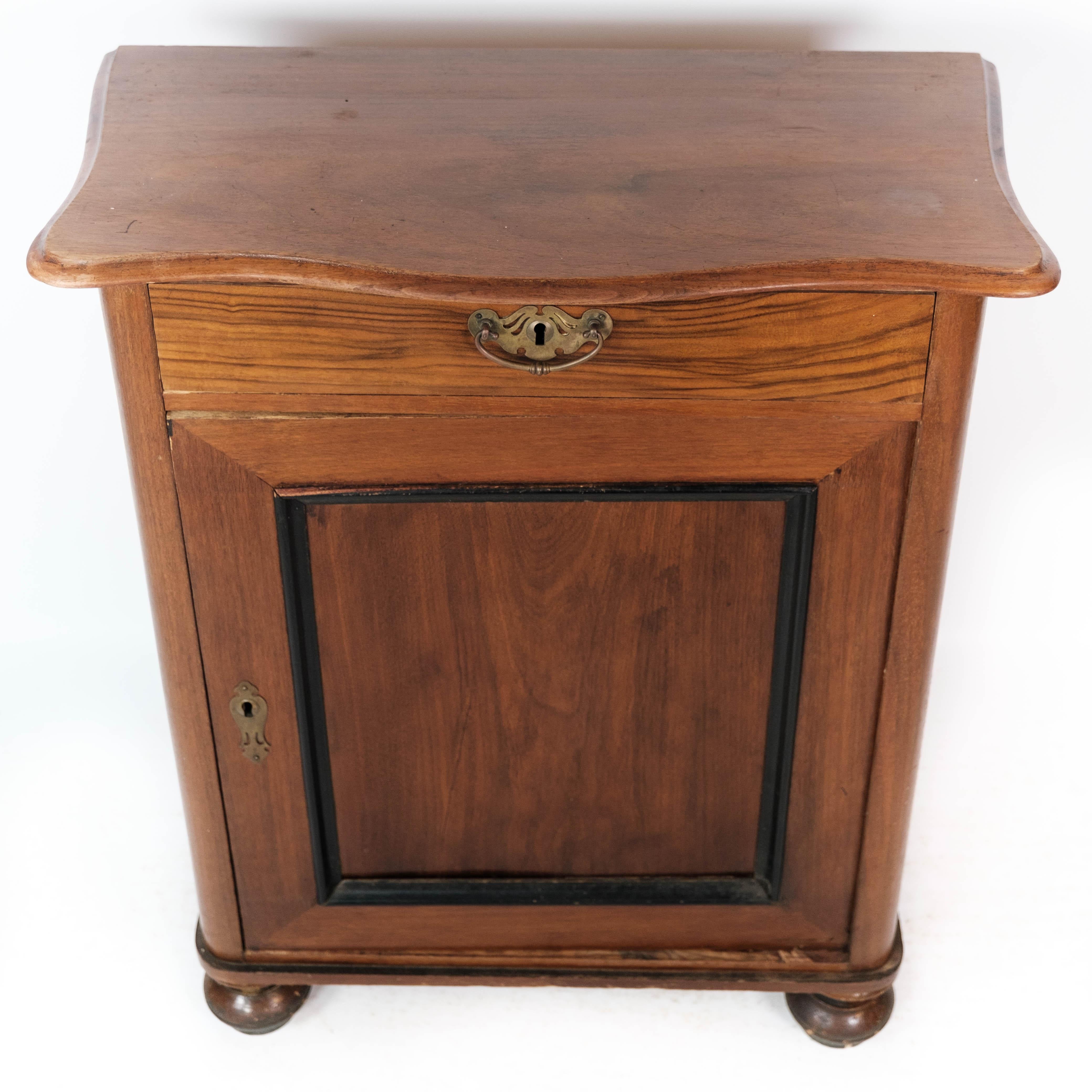 The entryway cabinet, crafted from rich mahogany, stands as a testament to the elegance and craftsmanship of the late 19th century. Dating back to around 1880, this exquisite piece is in superb antique condition, showcasing its enduring beauty and