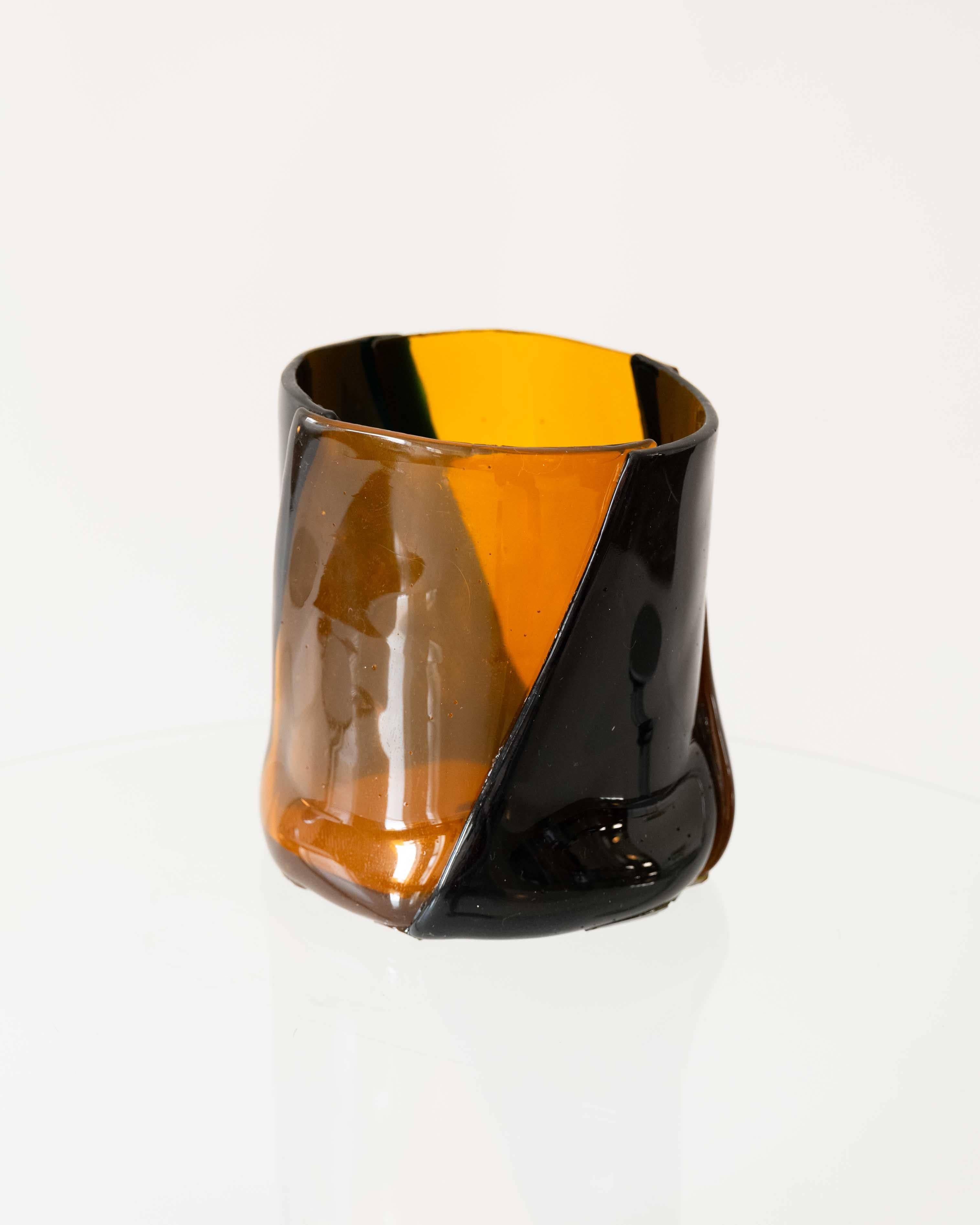 Vase in soft resin designed by Enzo Mari .A striking edition featuring a graphic amber-and-black pattern. Bold and playful, this large resin vase brings both function and visual tension. 
