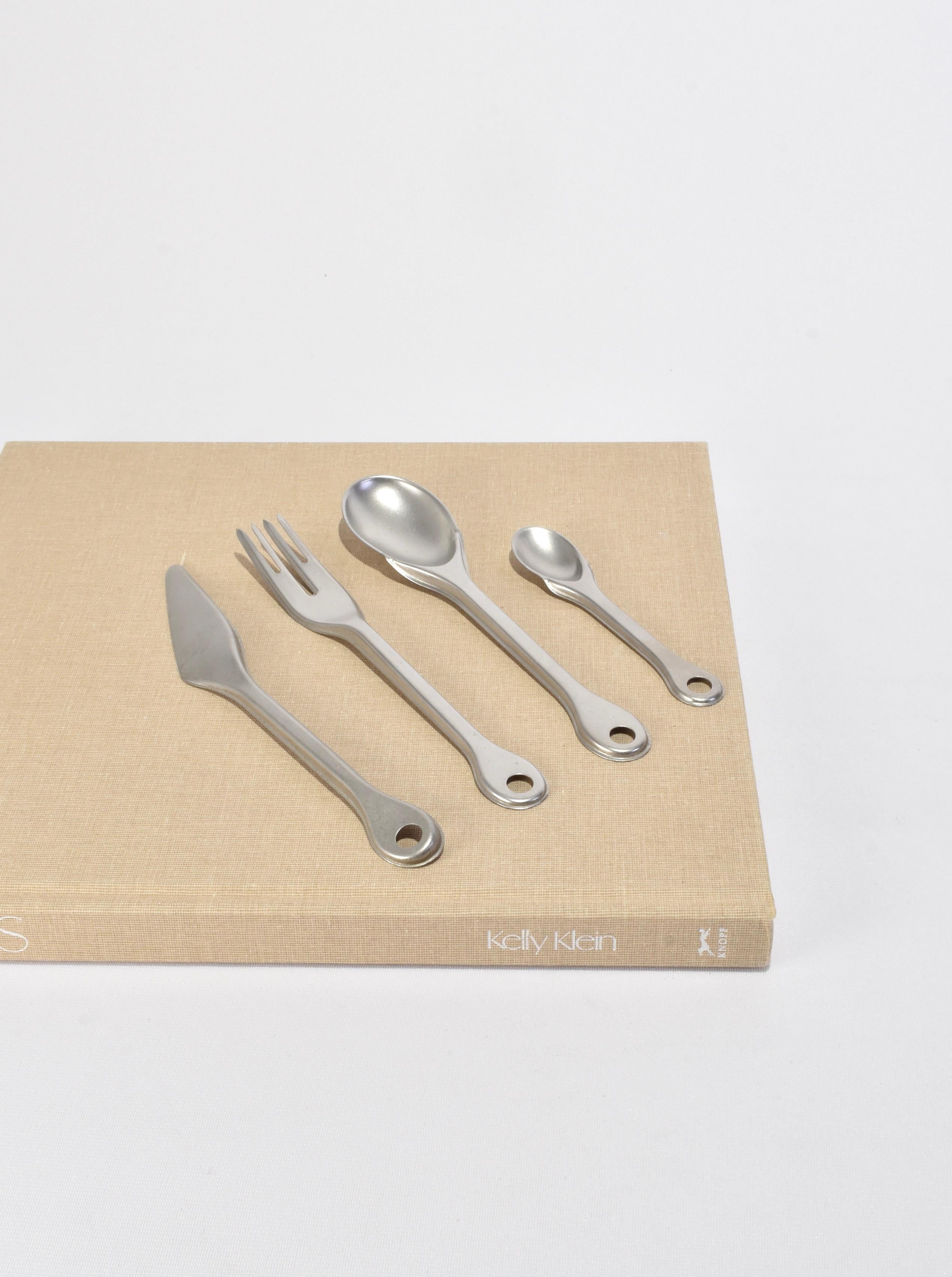 Rare, 4-piece flatware set 'Piuma' designed by Enzo Mari in 1996 for Zani & Zani Italy. Made from lightweight 18/10 stainless steel in a matte finish. Each piece is stamped Enzo Mari per Zani&Zani Italy.

Purchase includes one set of four pieces,