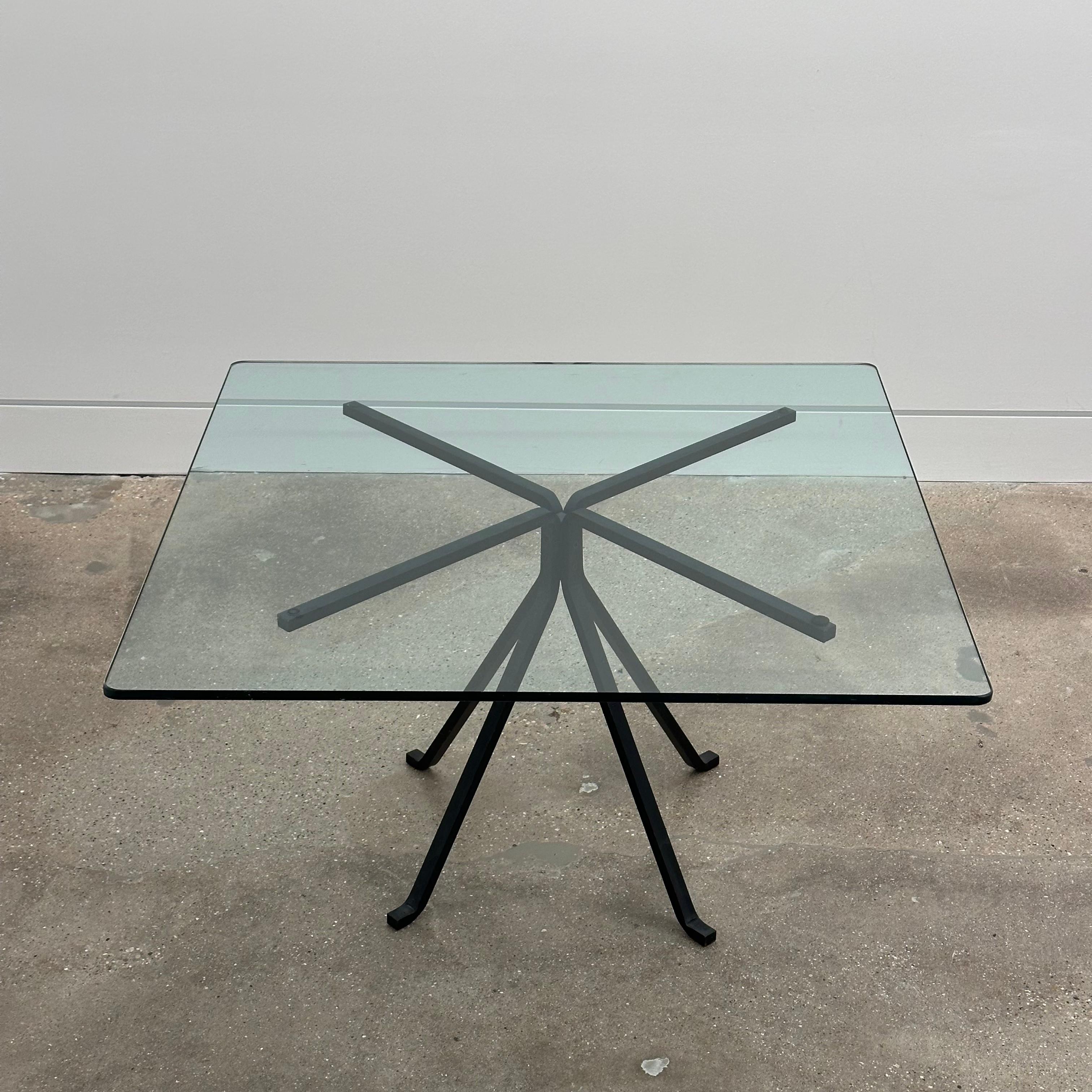 Enzo Mari ”Cuginetto” coffee table for Driade, Italy 1976. A quiet dynamism achieved through a clever combination of transparencies and sleek lines distinguishes this coffee table by Enzo Mari. Four legs are bent at the base to incorporate the feet,