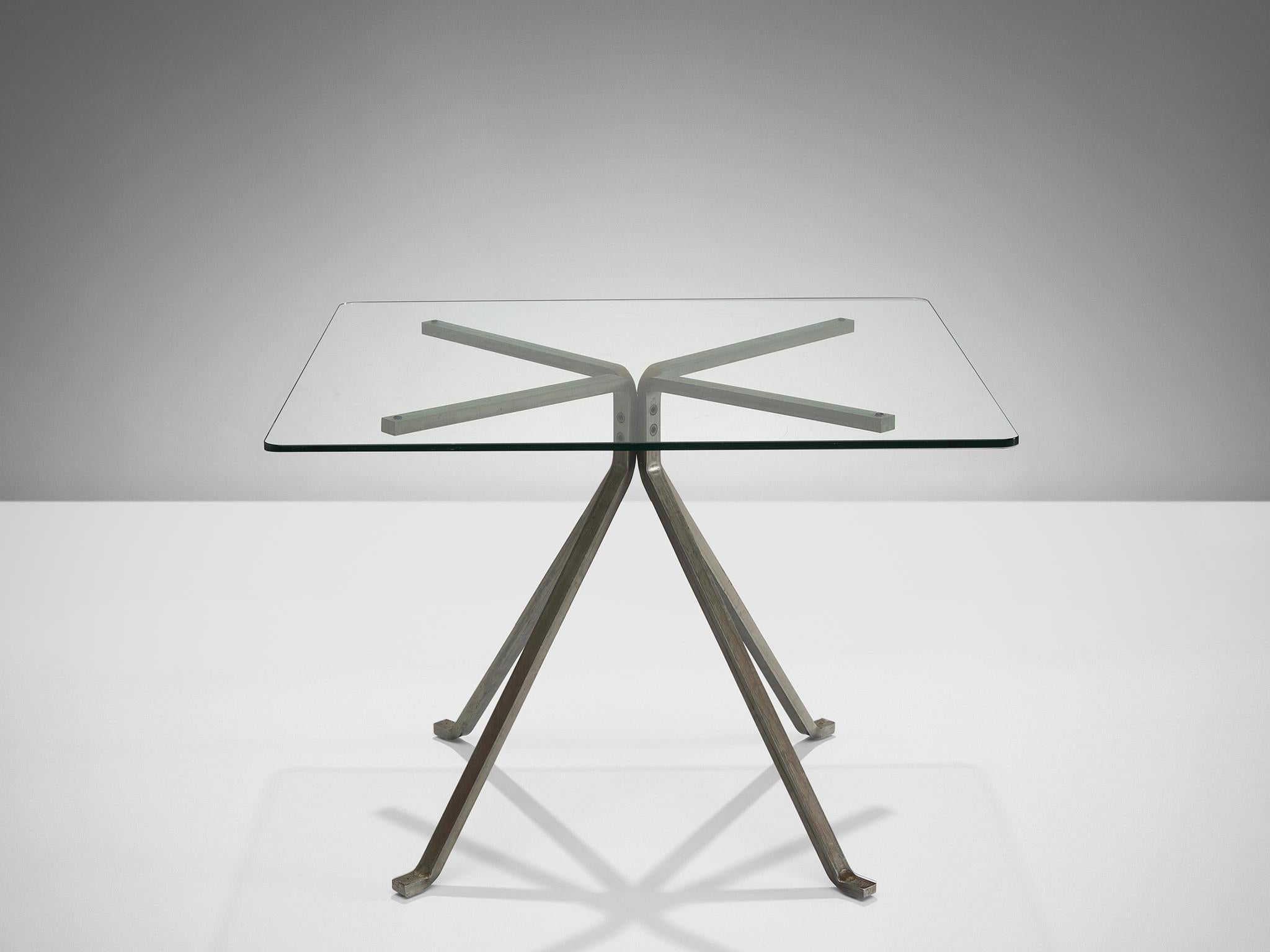 Enzo Mari for Driade, side table 'Cugino', glass, brushed steel, Italy, 1973.

This table features a clear construction. The base consists of four tapered legs executed in black anthracite steel that holds the square glass top in place. The
