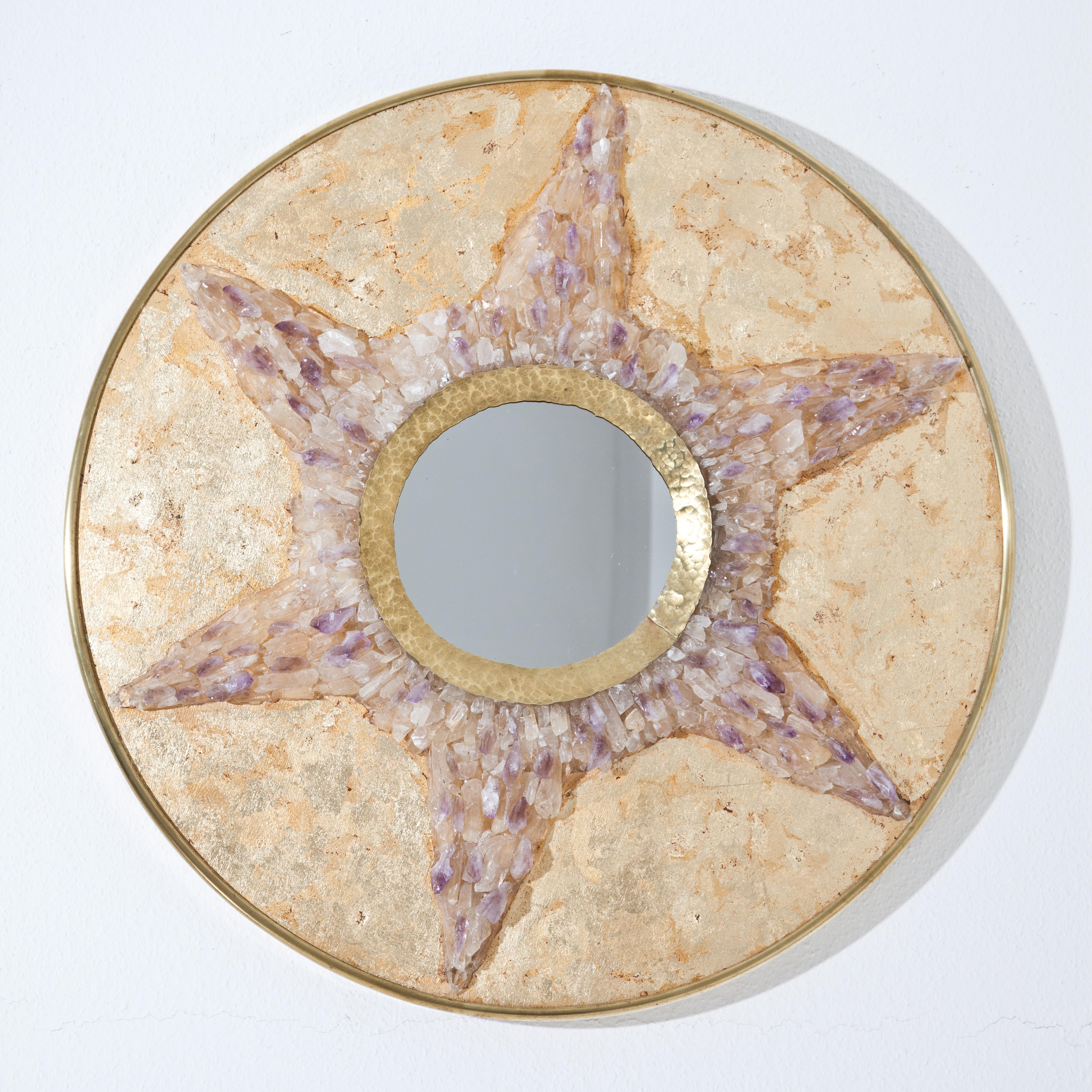 Round mirror in brass frame covered with gold foil and star-shaped decor of amethyst and rock crystal. The inner frame around the mirror glass is made of hammered bronze. On the back monogrammed EM.