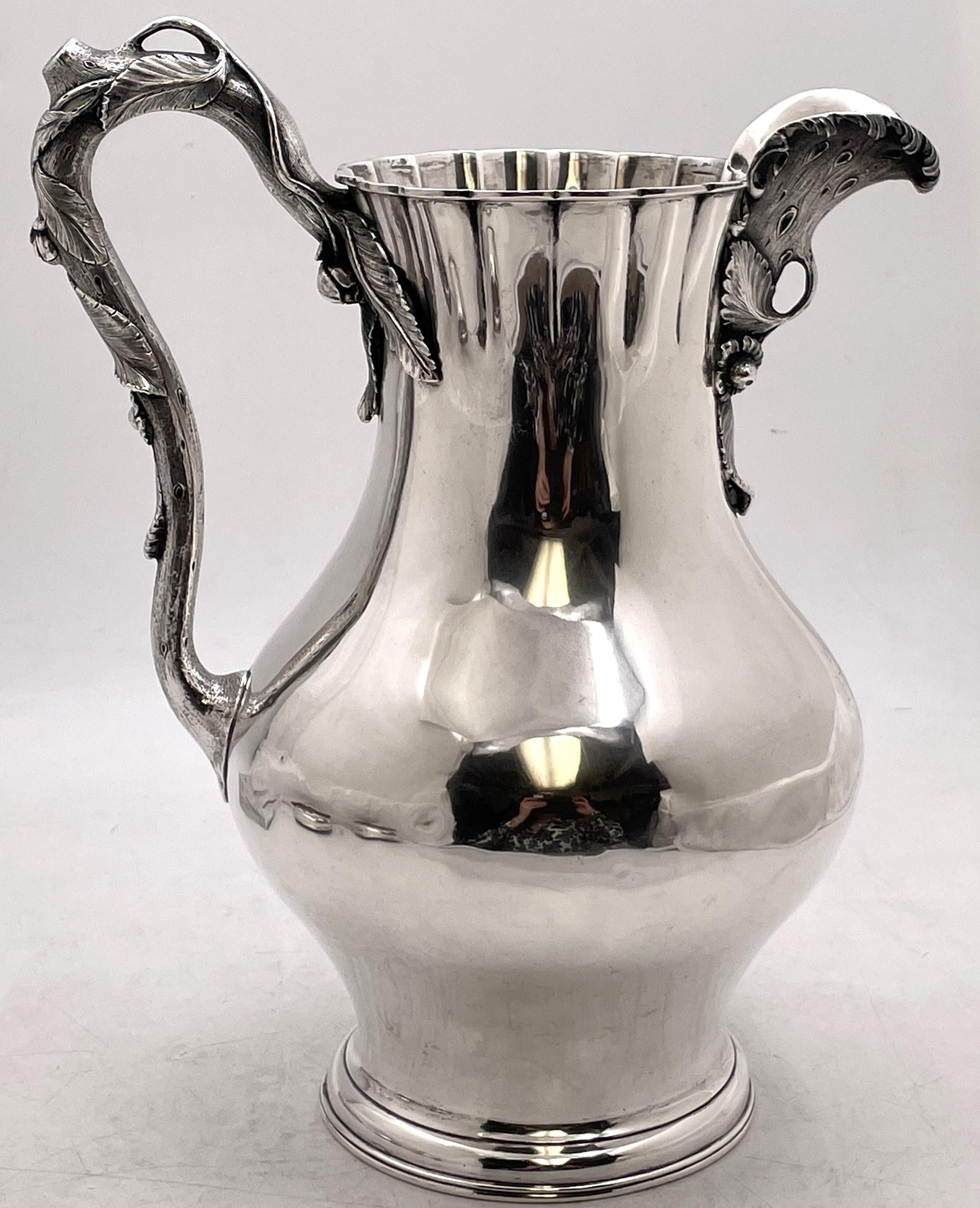 Eoff & Shepard for Ball, Black & Co, coin silver pitcher, made between 1852 and 1861, beautifully adorned with raised natural motifs on the spout and handle. It measures 11 1/2'' in height by 9'' from handle to spout by 7 1/2'' in depth, weighs 31.3
