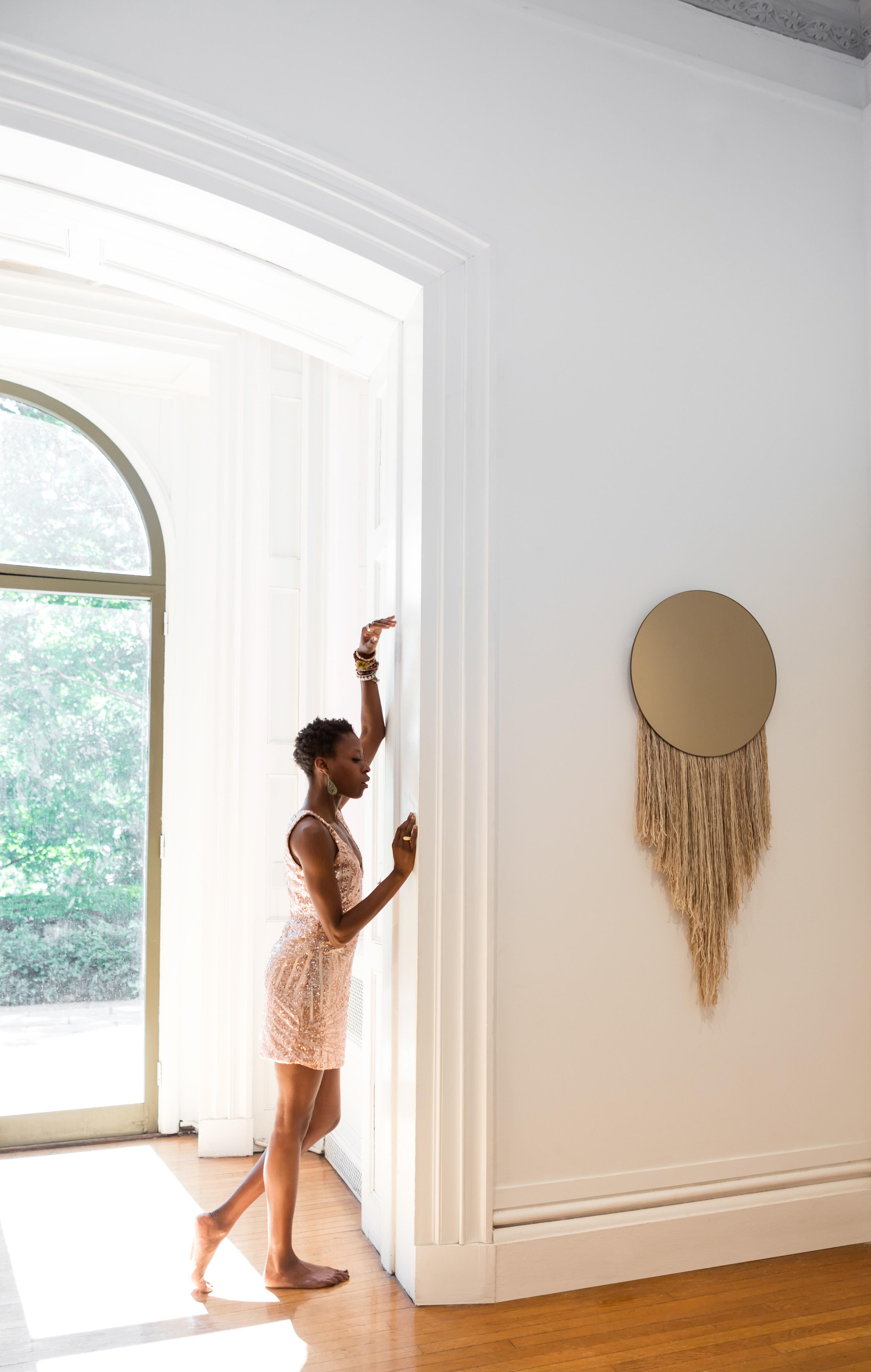 Named after the ancient Greek goddess of Dawn, the Eos mirror explores the relationship between the functional and nonfunctional elements of objects, including the utility of a mirror with the warmth and joie de vivre of fiber.

Customization in