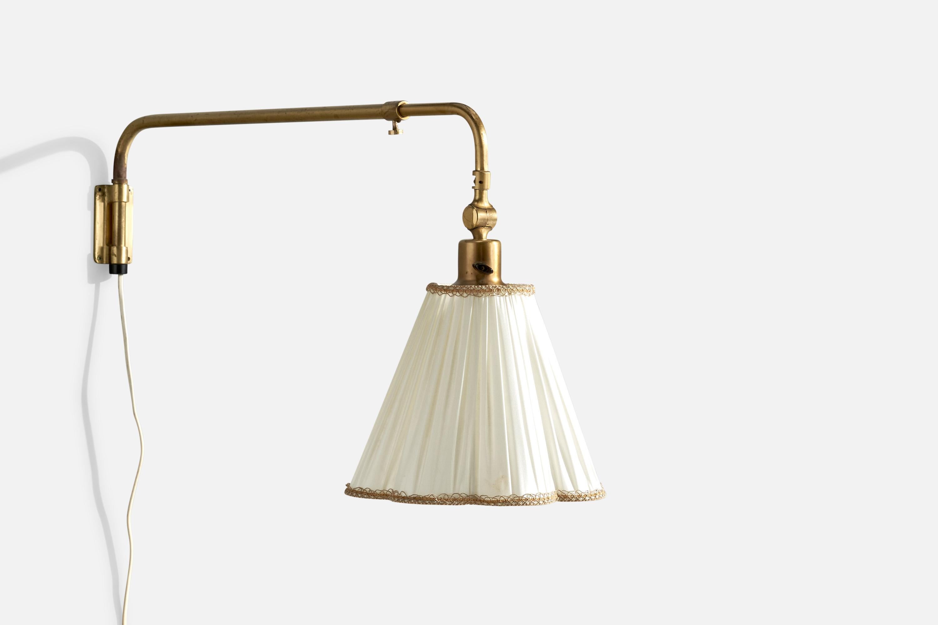 An adjustable brass and fabric wall light designed and produced by EOS, Sweden, c. 1940s. 

Overall Dimensions (inches):  15.75” H x  9.75” W x  25.5“D
Back Plate Dimensions (Inches):  4” H x 2” W x .25” D
Bulb Specifications: E-26 Bulbs
Number of