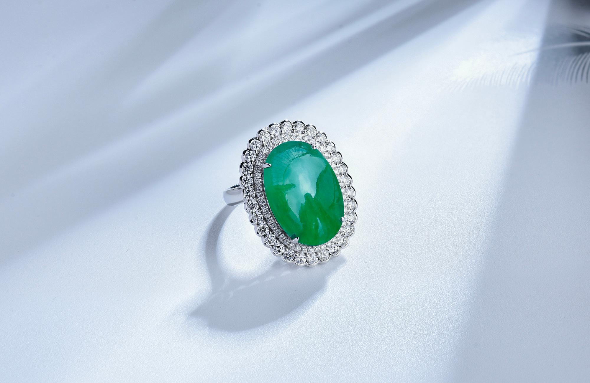 This is a cluster green jadeite ring. The Jadeite can be detached from the ring and converted into a pendant. With such big Jadeite it will make perfect cocktail ring and suitabled for any event.

The green jadeite is surrounded by 2 circles of