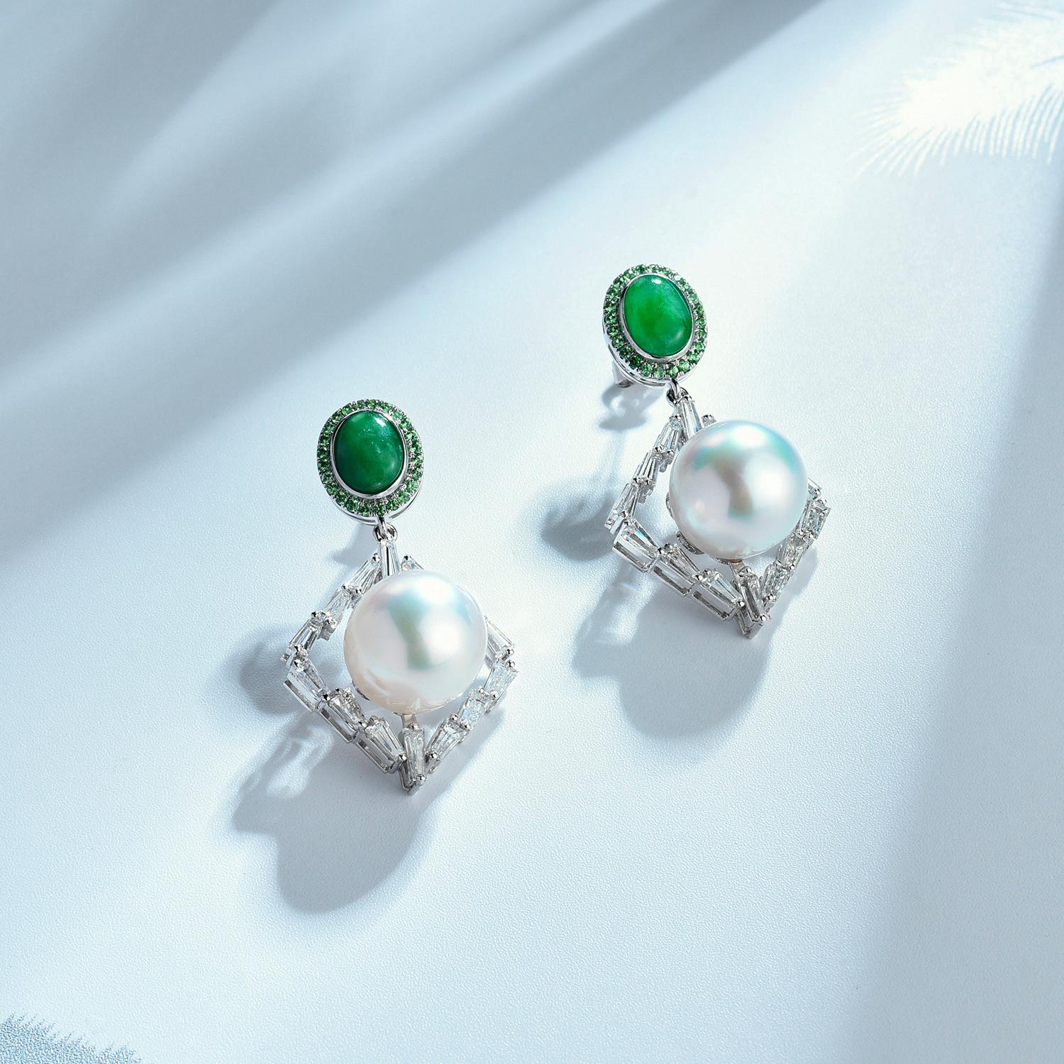 A Type A Natural Green Colour Jadeite Jade,  and Diamond Ring in 18k White Gold. The South Sea Pearls are surrounded by matrix of baguette diamonds in an ArtDeco style and they are suspended below the Jadeite cabochon. The Jadeite Cabochons are