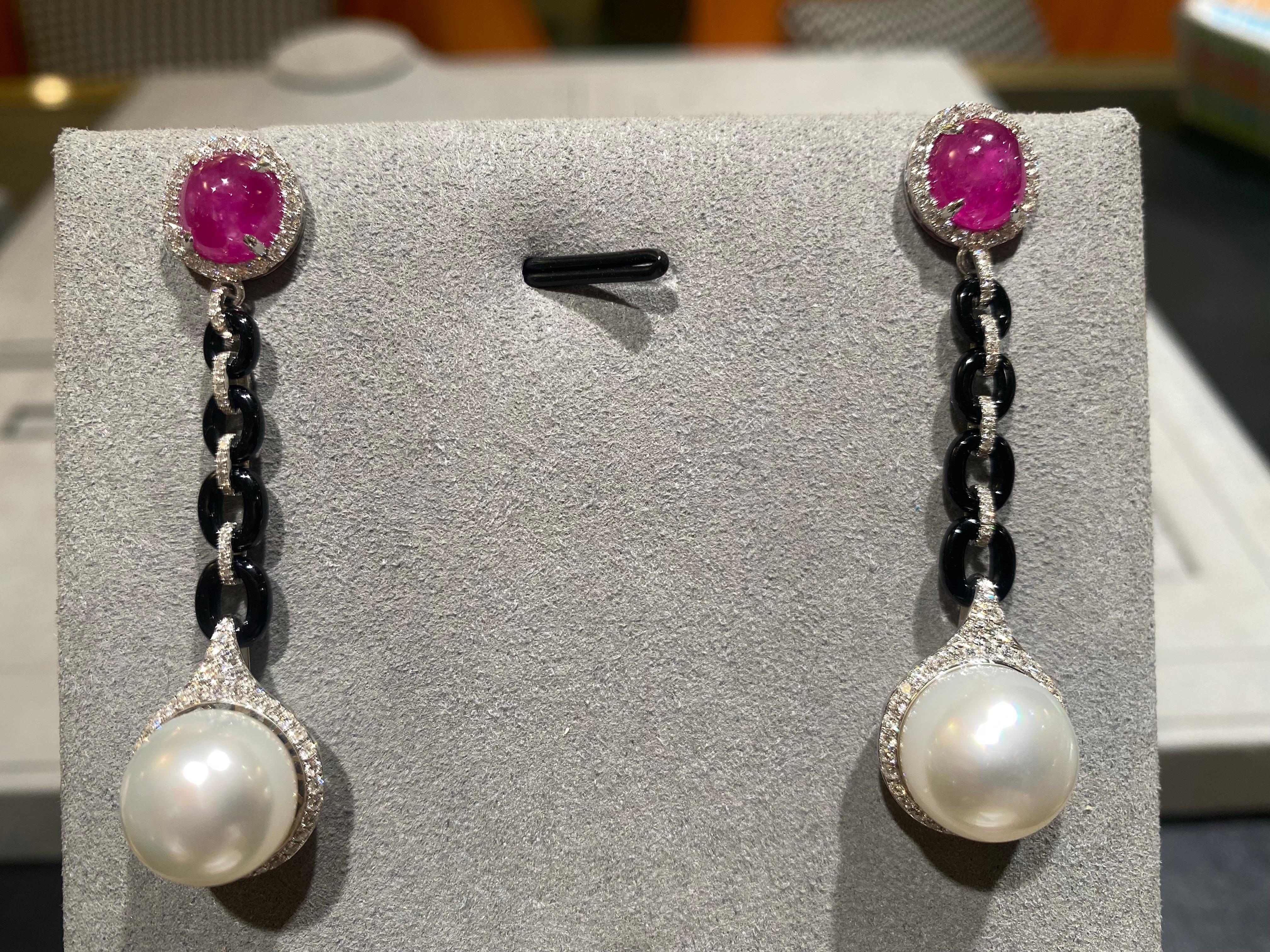  Australian white south sea pearl 12.4mm.
Ruby cabochon are traditional heated 6.78CT, 
Brilliant cut natural diamond in E/F colour, VS clarity total weight 1.348CT.
This earring is set in 18K white gold.
Black onyx is natural and hand crafted.
this