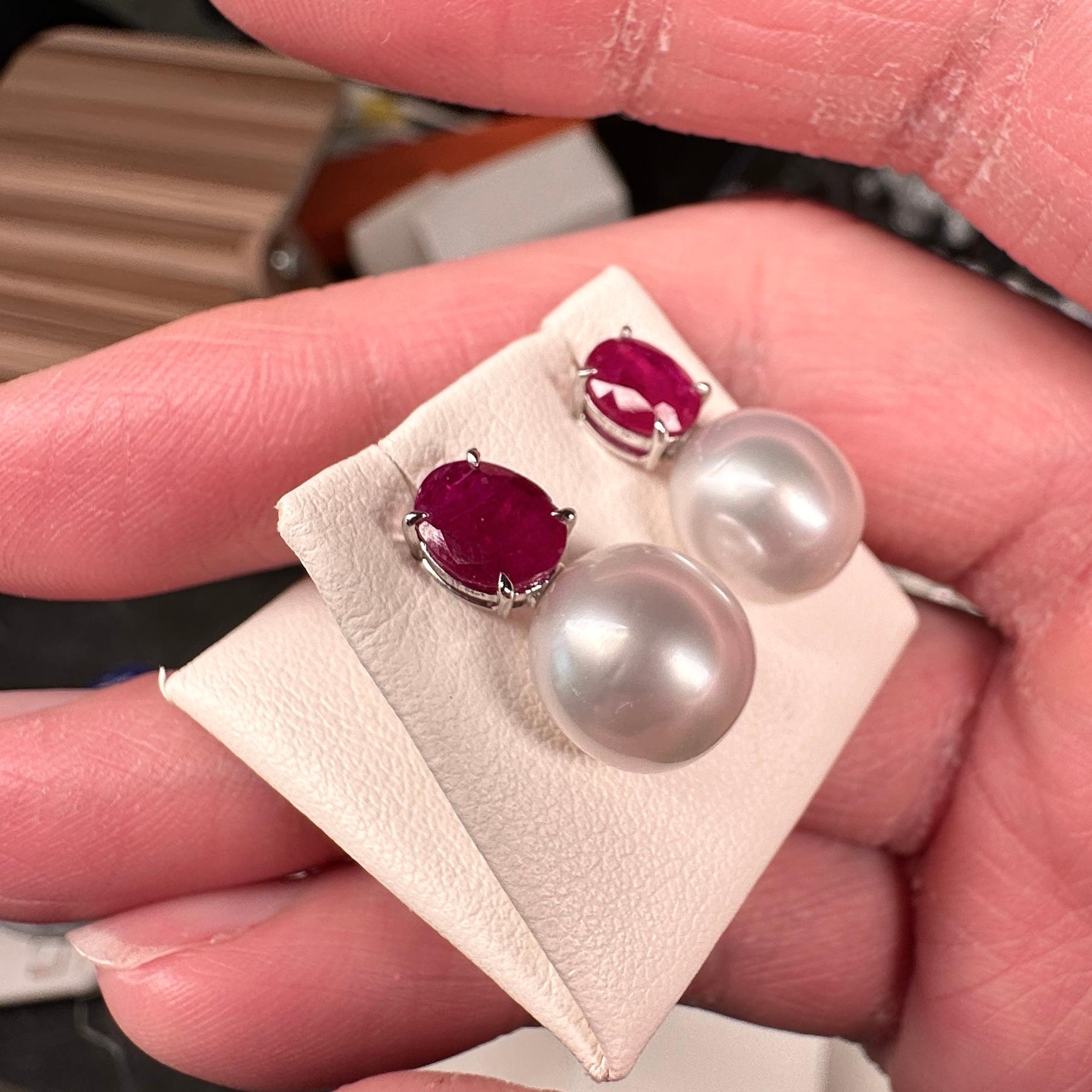 A pair of 9.5 mm oval south sea pearl, ruby  earrings in 18k white gold. This earrings is consist of an oval south sea pearl hanging below the ruby ear stud  It is a very classical design and is perfect for any occasions. The south sea pearls are