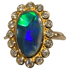 Eostre Solid Opal and Diamond Ring in 18k Yellow Gold