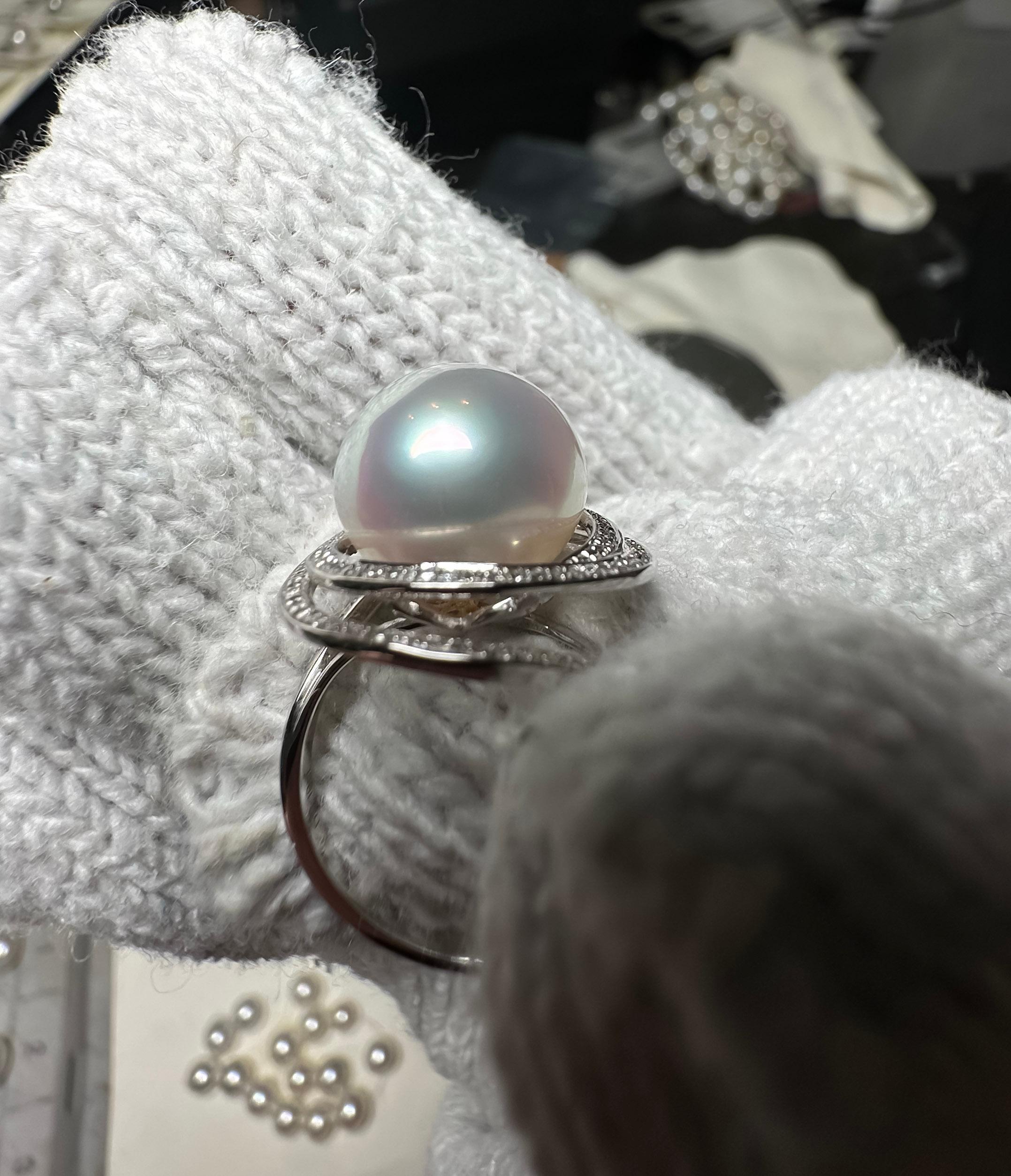 Eostre South Sea Pearl  and Diamond Ring in 18k White Gold. The pearl  is flawless with very high lustre. The colour is pinky white. 

The South Sea Pearl is  12mm


The colour of the diamond is approximately E/F with VS clarity 

