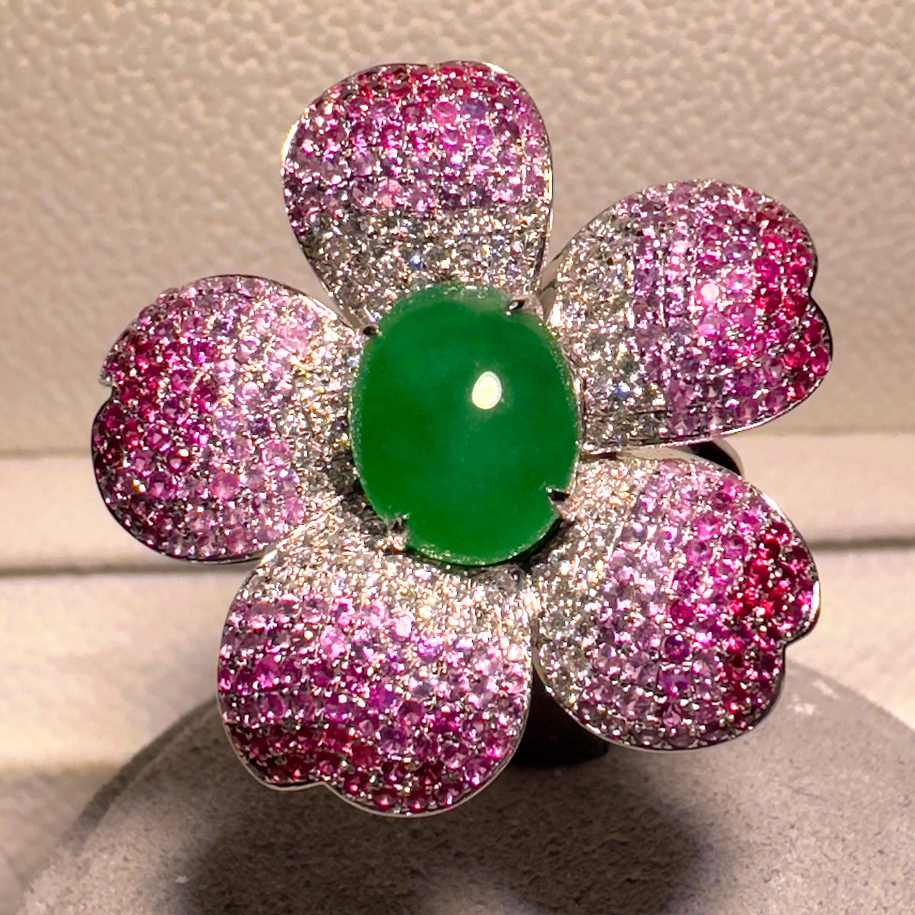 This ring is inspired by the cherry blossom. This is a convertible pendant ring which means it can be worn as a ring or as a pendant. The Type A Green Jadeite is located at the center of the ring and is surrounded by 5 cherry blossom petals. Each