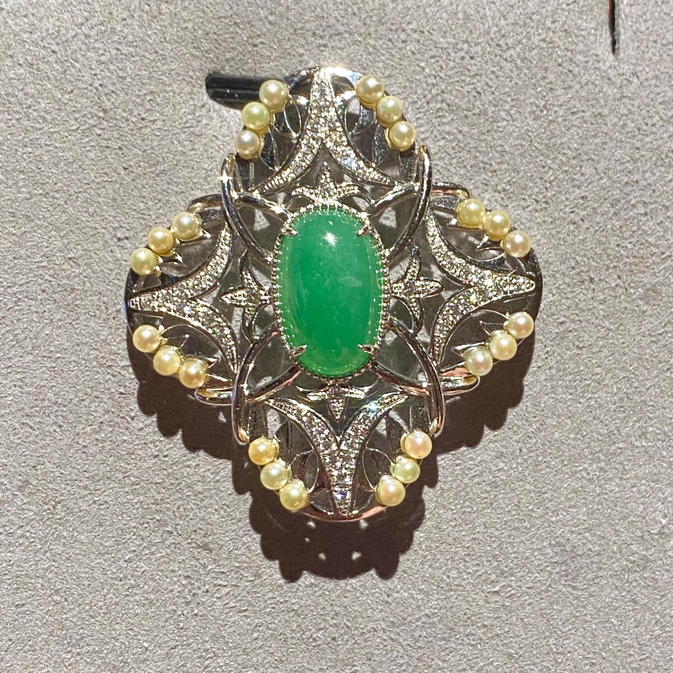 This is a Type A Green Jadeite Pendant. The pendant is of a flower motif with 4 petals. The green jadeite is located at the center of the pendant and is surrounded by 4 similar petal like motif. There are 6 seed pearls in each motif and which 3 are