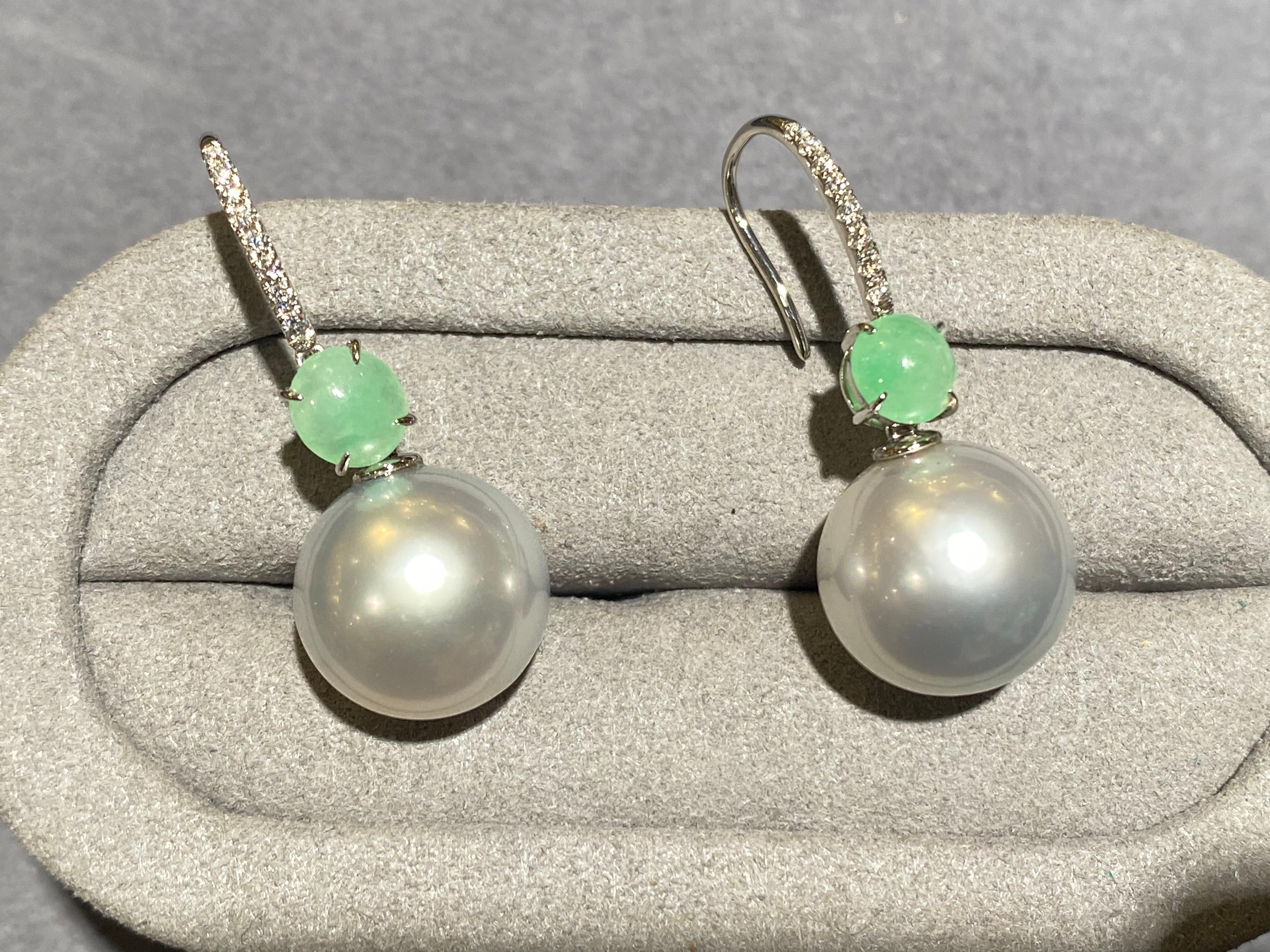 A pair of Type A green jadeite, white Australian south sea pearl and diamond earrings in 18k white gold. It is a simple dangle/drop earrings with the south sea pearls at the bottom and the jadeite cabochon connecting the south sea pearl and the