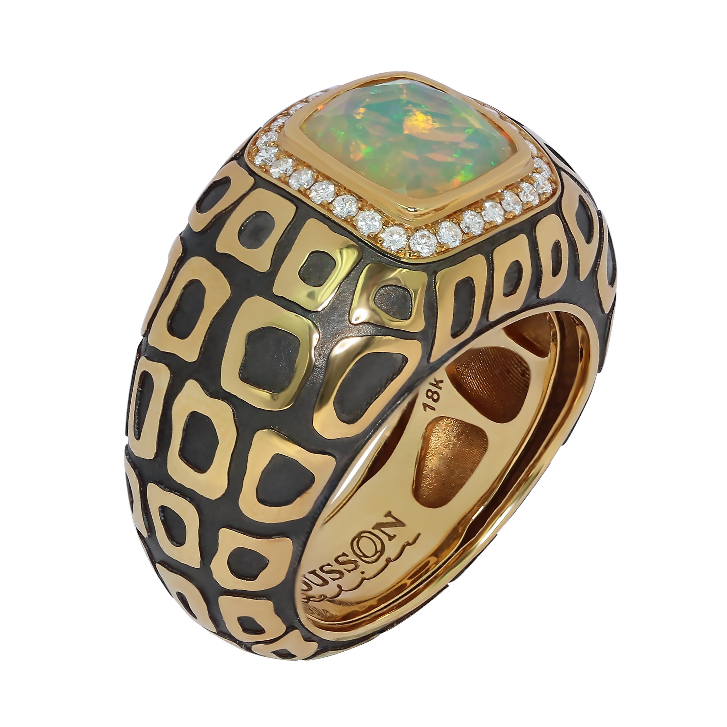 Ethiopian Opal 1.27 Carat Diamonds 18 Karat Yellow and Black Gold Ring
Looking at the opals, it is impossible to look away. In the case of this Ring as well. The combination of orange, green, and blue shades of this astounding 1.27 Carat Ethiopian