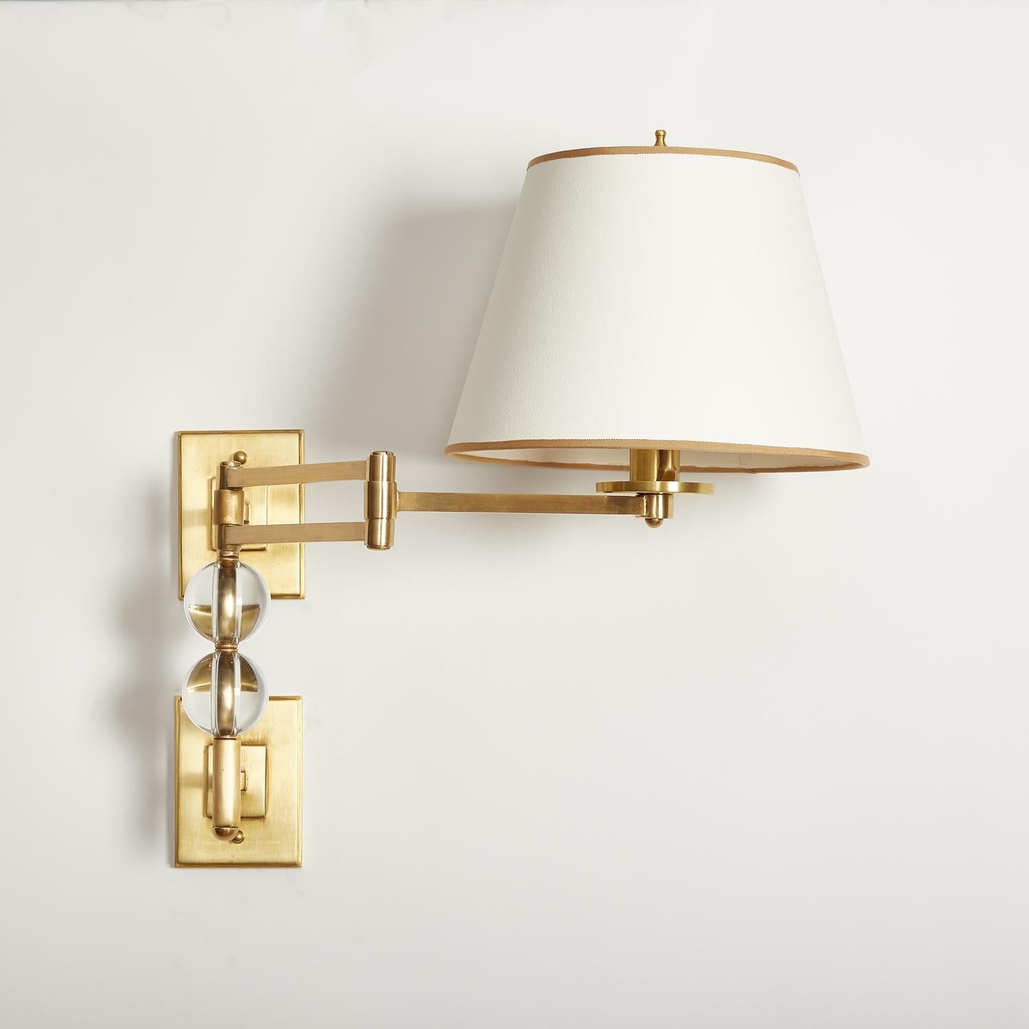 A pair of custom swing arm sconces that feature two overscaled Murano glass beads, adding elegance to a modern design. Rectangular backplates issue one medium Edison base socket each, 100 watts maximum. Swing arm is 13.5