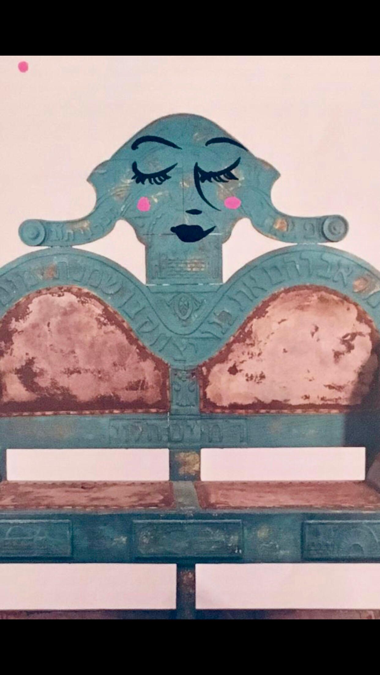 This is a take on an ad featuring an antique judaic carved wood circumcision chair from the community of Hebron is Israel. titled Mama with Challah.

The bold and eclectic work of self taught artist Ephraim Wuensch is part social commentary part