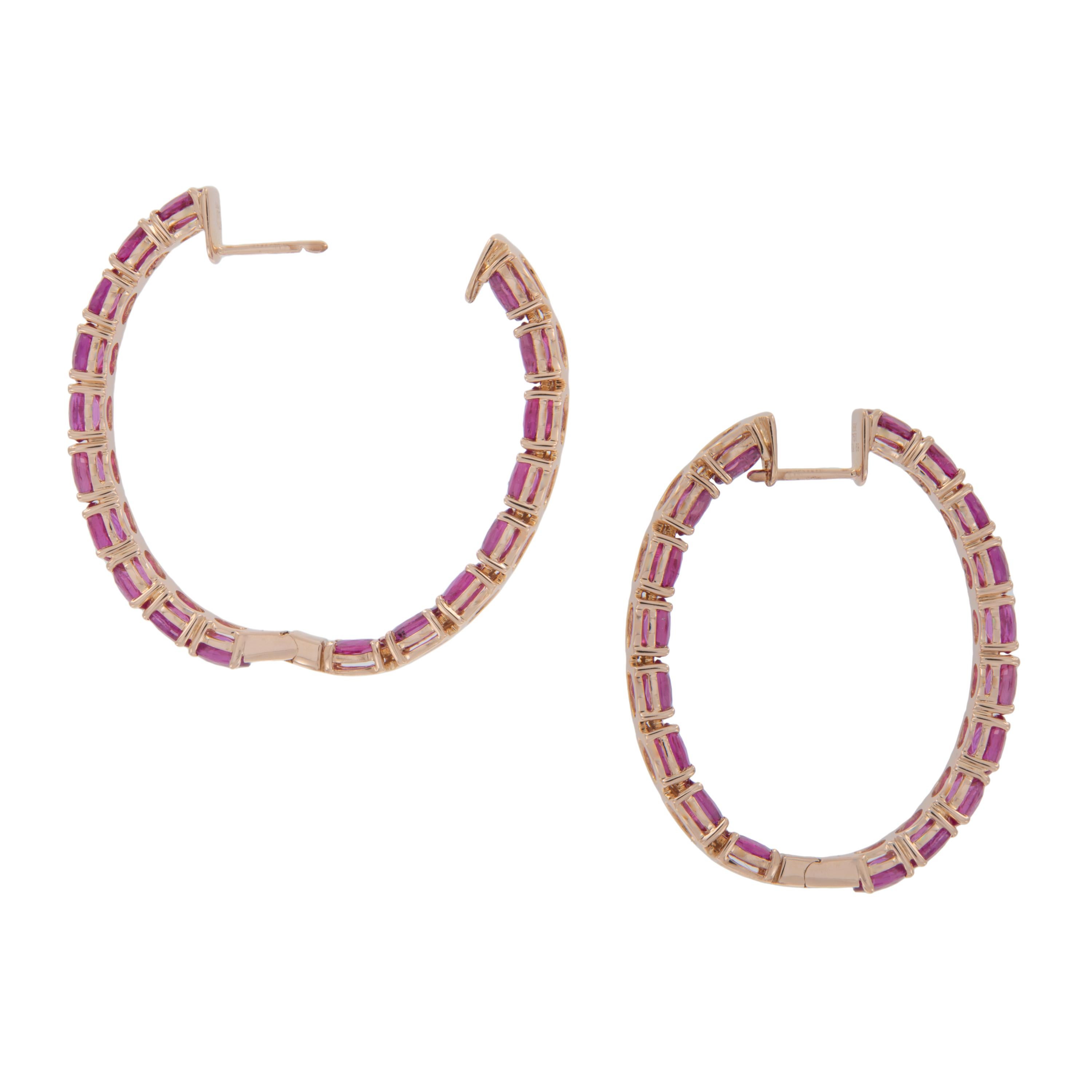 Make a statement with these large oval hoop earrings! The 18 karat rose gold perfectly sets off the lovely red rubies= 11.62 Cttw that you can see from any direction being set in inside outside fashion. Complimentary signature wrapping &