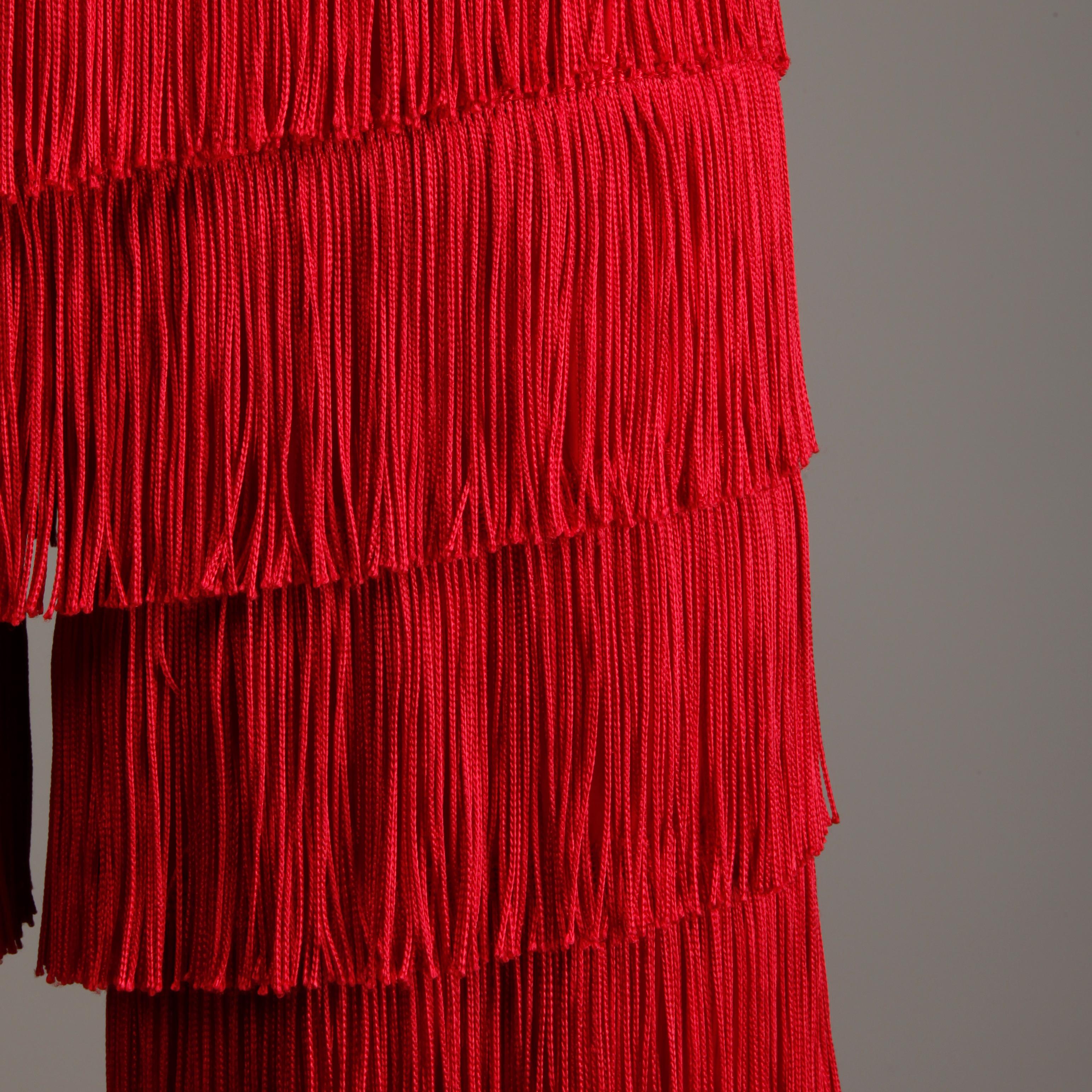 Incredible vintage 1960s bright red tiered fringe pants! A great alternative to a statement skirt. Unlined with rear metal zip and hook closure. Fits like a modern size medium. The waist measures 30