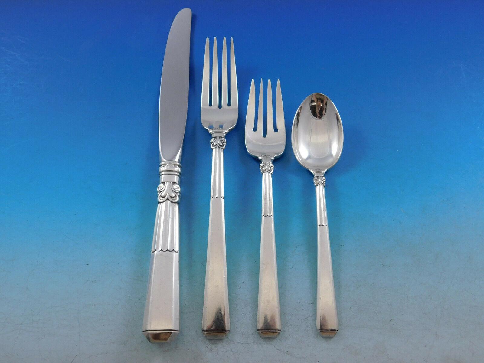 Scarce dinner size epic by Gorham, circa 1941, sterling silver flatware set, 65 pieces. This set includes:

12 dinner knives, 9 1/2