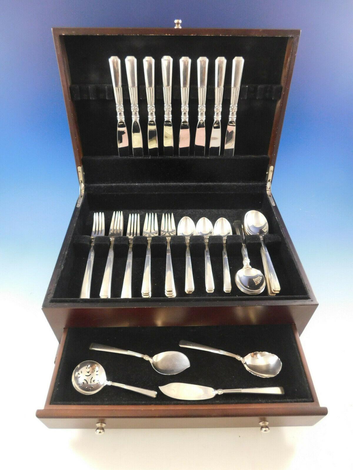 Epic by Gorham, circa 1941, sterling silver flatware set, 44 pieces. This set includes:

8 knives, 8 3/4