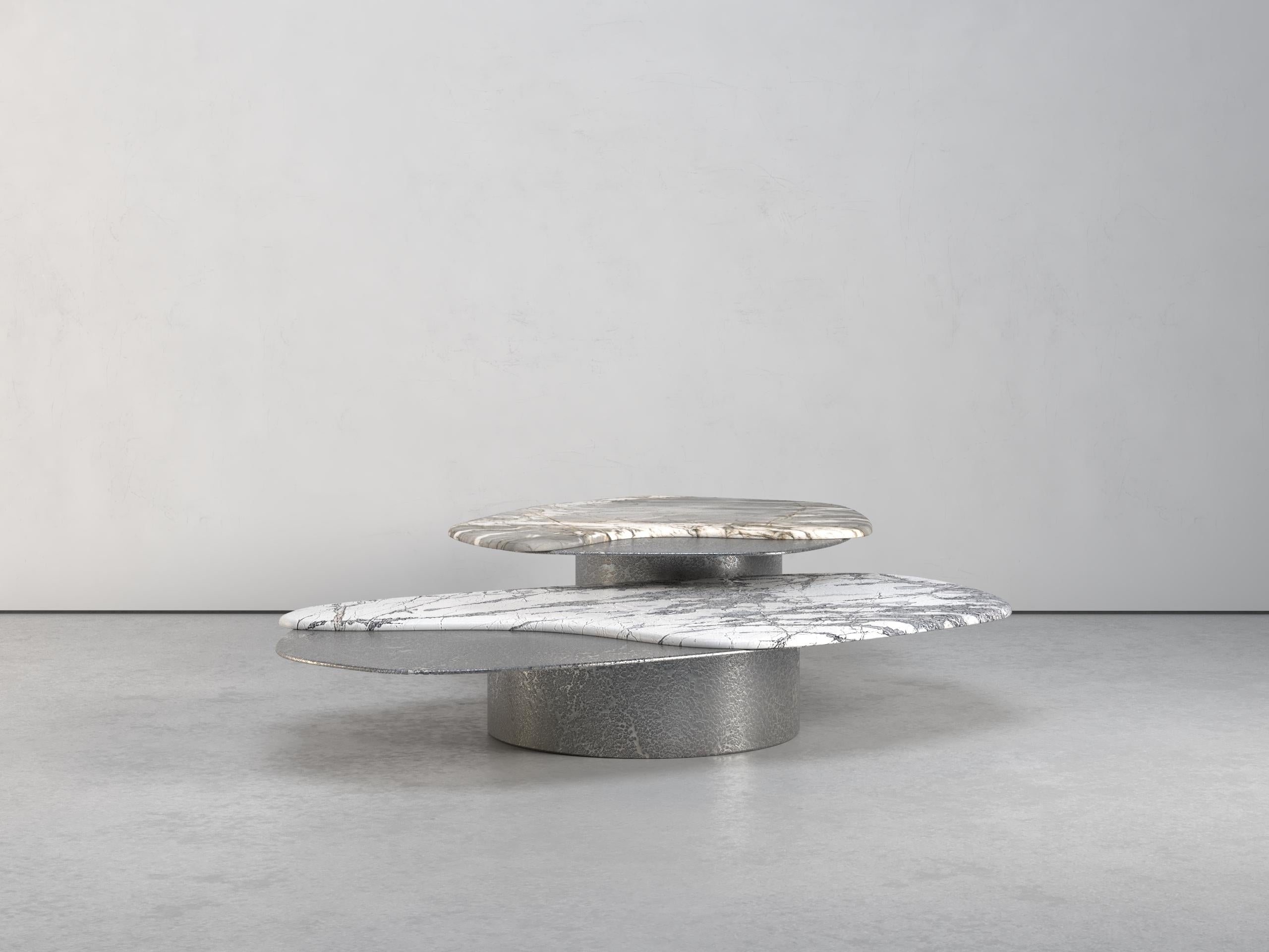 The Epicure IV coffee table set, 1 of 1 by Grzegorz Majka
Edition 1 of 1
Dimensions: 63 x 63 x 13 in
Materials: aluminium, quartz and brass

“No man is an island entire of itself; every man is a piece of the continent, a part of the main.” The