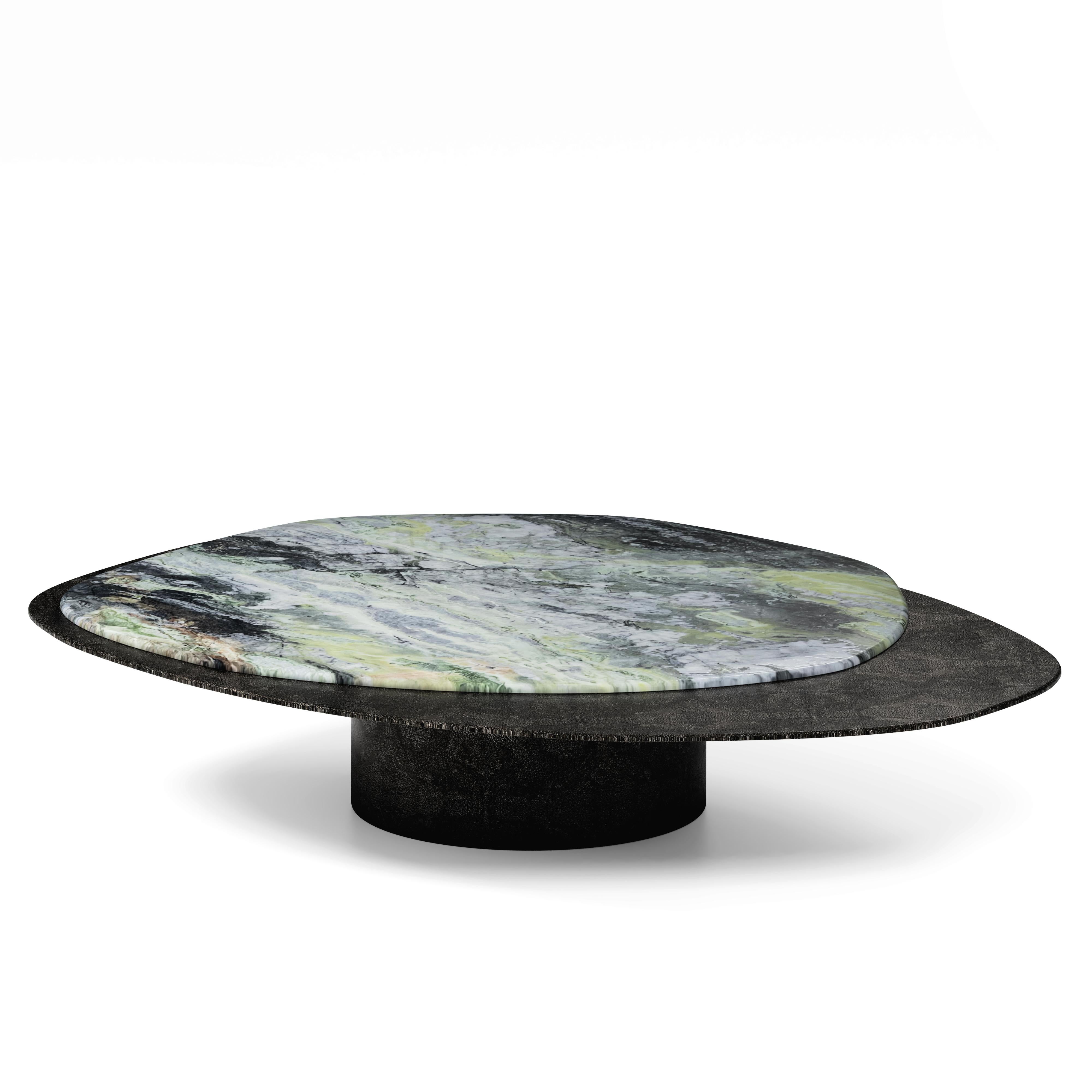 “The Epicure X” Contemporary center coffee table ft Jade River marble and antique nickel silver in regged ray skin

Luxury doesn’t always follow the common patterns. Luxury goes beyond and almost like one of the best gourmets joins varied