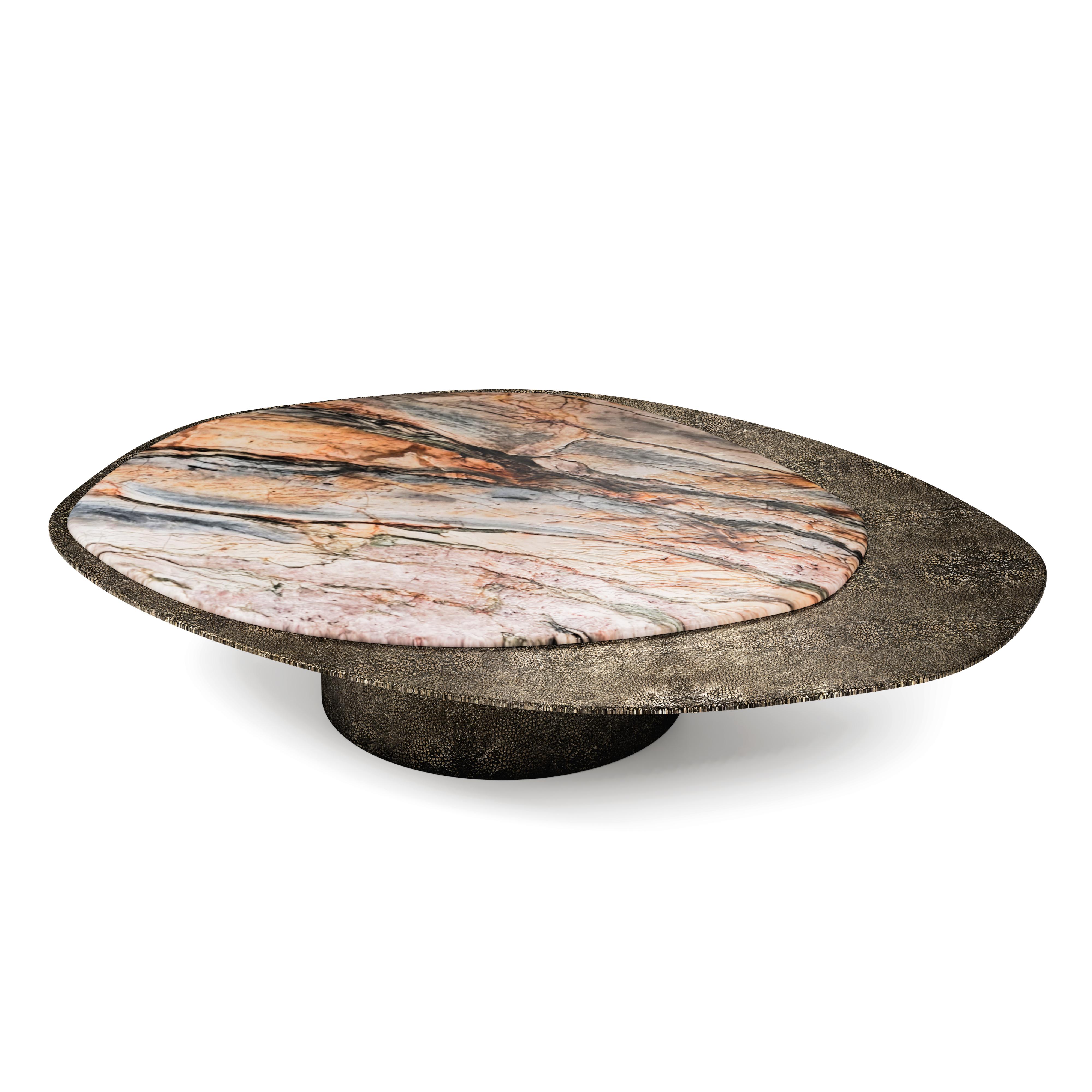 “The Epicure XI” contemporary center coffee table ft Michelangelo quartzite and aluminium elements in Antique Bronze regged ray skin

Luxury doesn’t always follow the common patterns. Luxury goes beyond and almost like one of the best gourmets