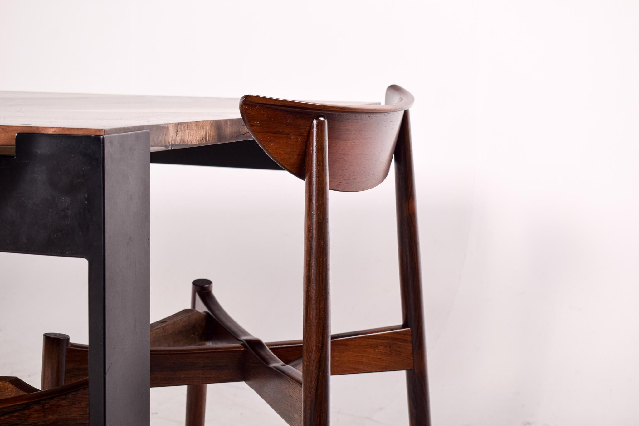 Beautiful conjugation between the true nature and form of walnut slabs with the solid and transparent epoxy resin.
Blacked iron legs which give structure to the table and highlight the colors and forms of the tabletop. 
This contemporary table,