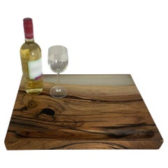 Epoxy cast walnut cutting board with strong character