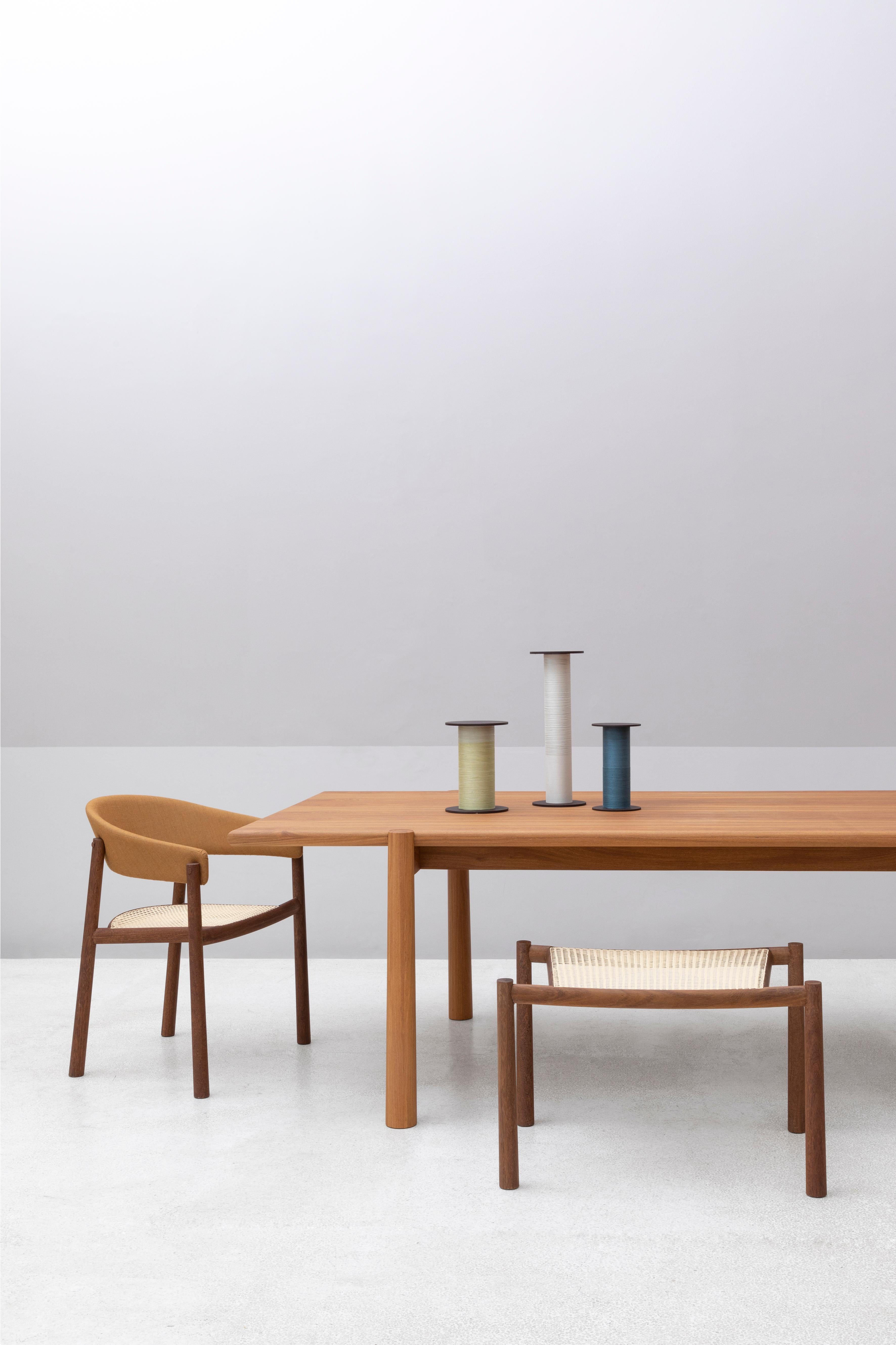The Equador bench, designed by ,Ovo, is a beautifully crafted piece that combines organic and geometric elements in a refined, precise design. Part of the Equador collection, which also includes a chair, armchair, and table, this bench stands out