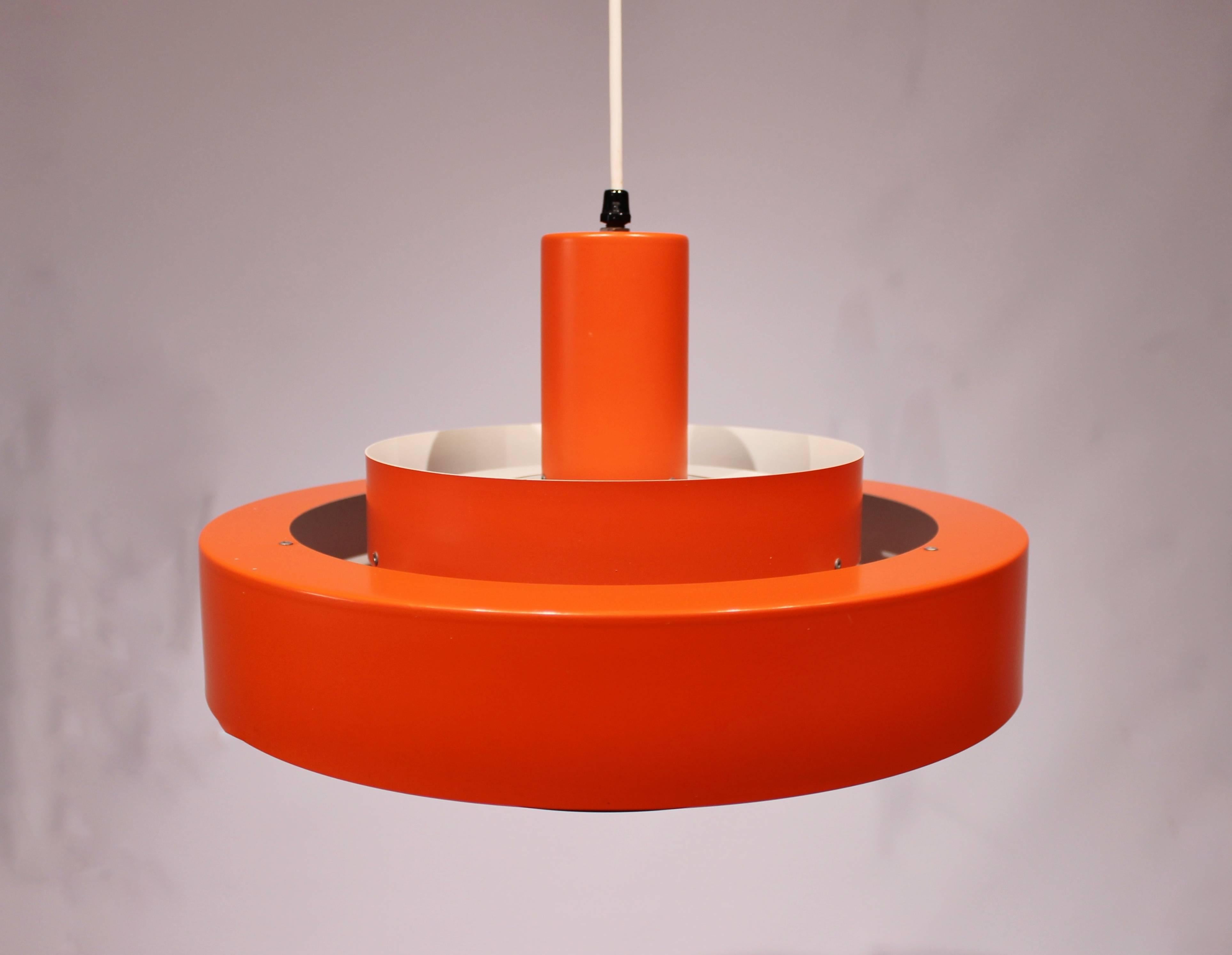 Equator pendant with orange/red lacquered metal shades designed by Jo Hammerborg for Fog and Mørup from the 1960s. The pendant is in great vintage condition.