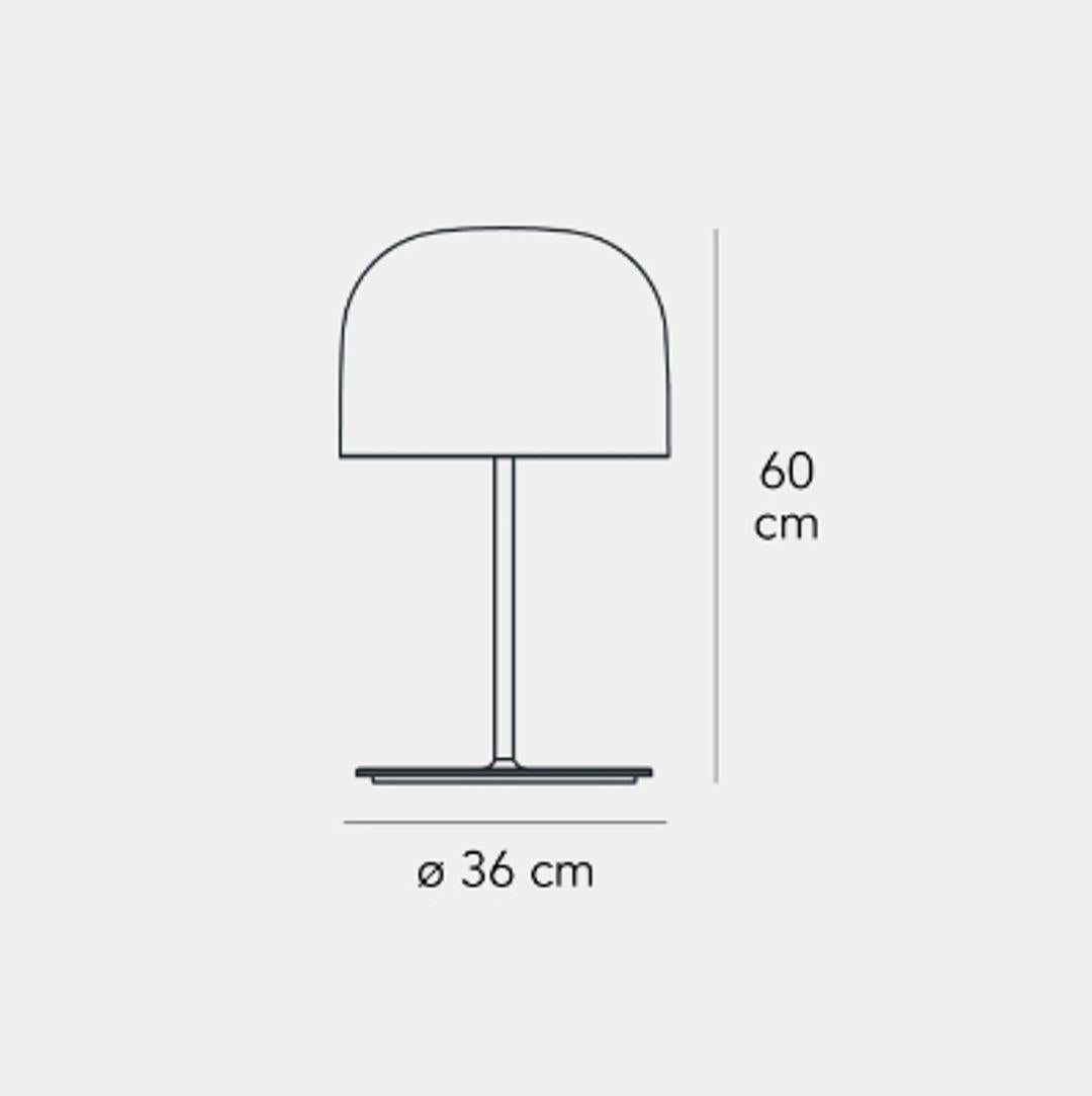 Equatore is a contemporary reinterpretation of the classic lamp with a glass shade. While the traditional abat-jour uses the shade to contain the light source within, in this family of lamps the shade is paradoxically and suggestively empty, with