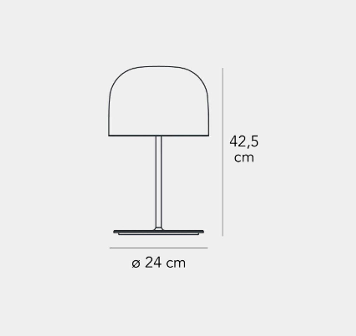 Equatore is a contemporary reinterpretation of the classic lamp with a glass shade. While the traditional abat-jour uses the shade to contain the light source within, in this family of lamps the shade is paradoxically and suggestively empty, with